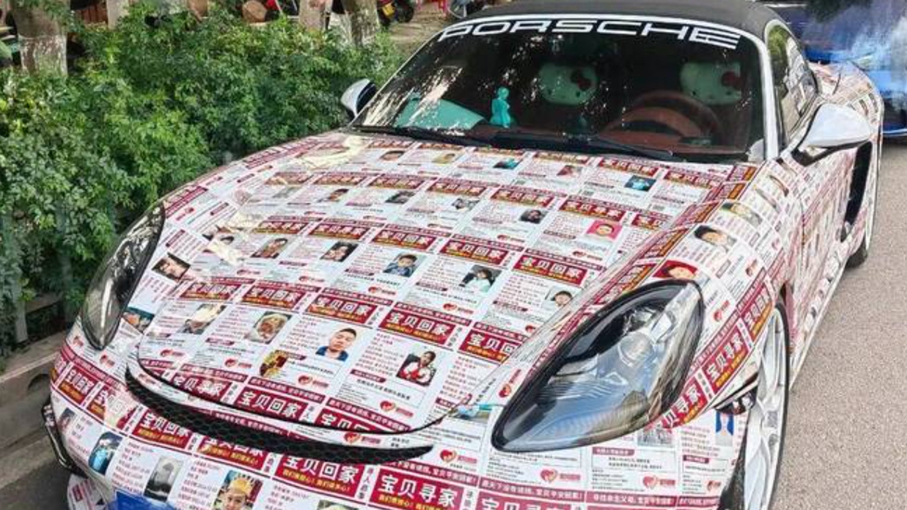A Porsche driver in Yunnan covered his luxury vehicle with over 90 missing-child flyers from the Baby Come Home charity, successfully helping to reunite a missing child with their family. Photo: Sohu