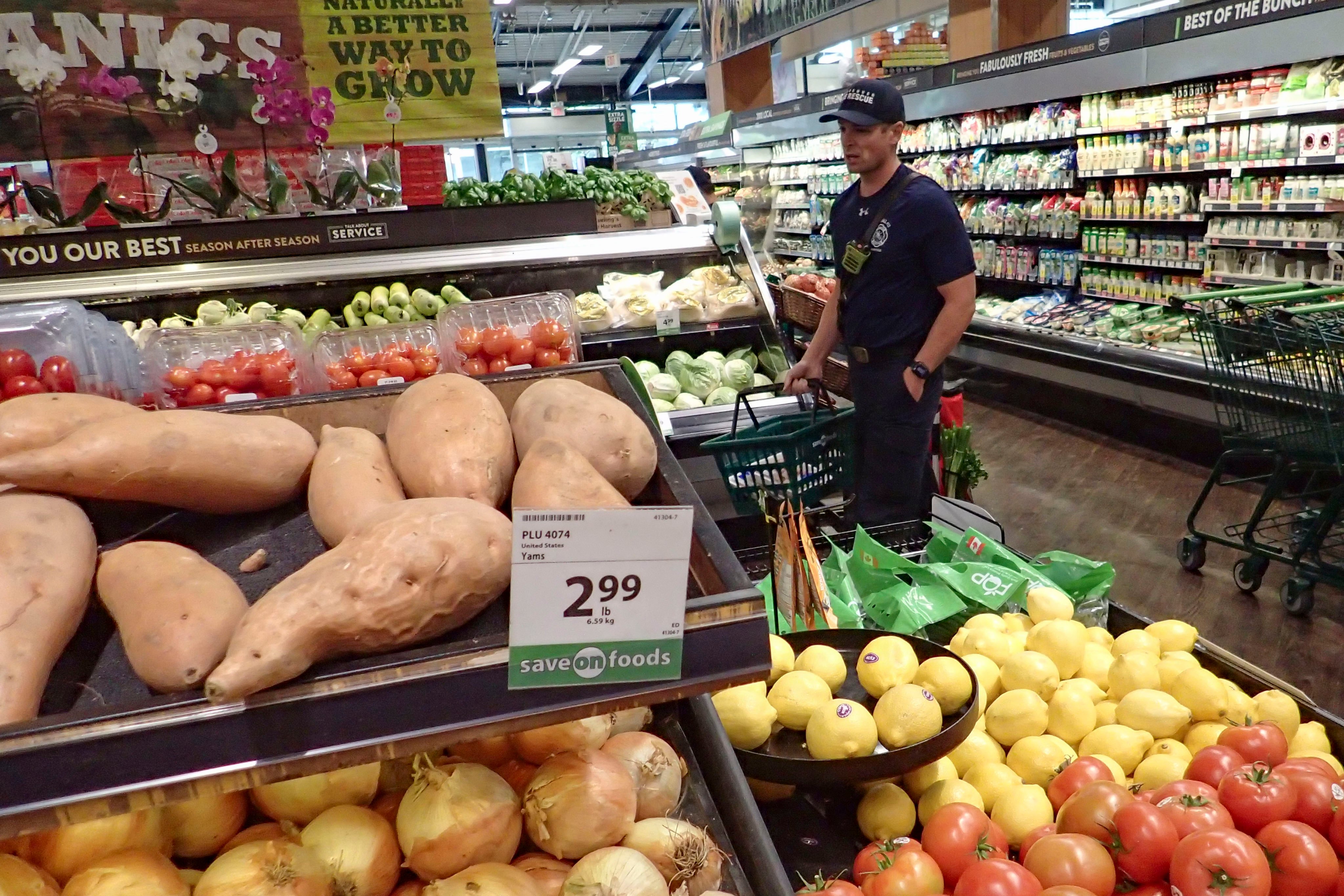 A customer shops for groceries at a supermarket in Vancouver, Canada, last month. Photo: Xinhua
