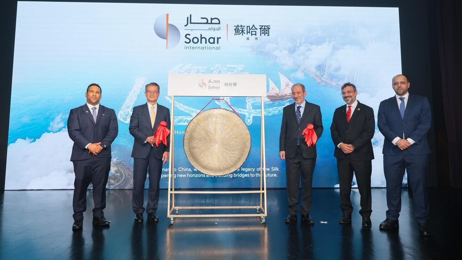 Financial Secretary Paul Chan (second left) and Abdulaziz Abdullah Al Hinai (third right), ambassador-at-large at Oman's Foreign Ministry, officiate at a gong-striking ceremony marking the launch of Sohar International’s Asia-Pacific office in Hong Kong on September 10. Photo: ISD