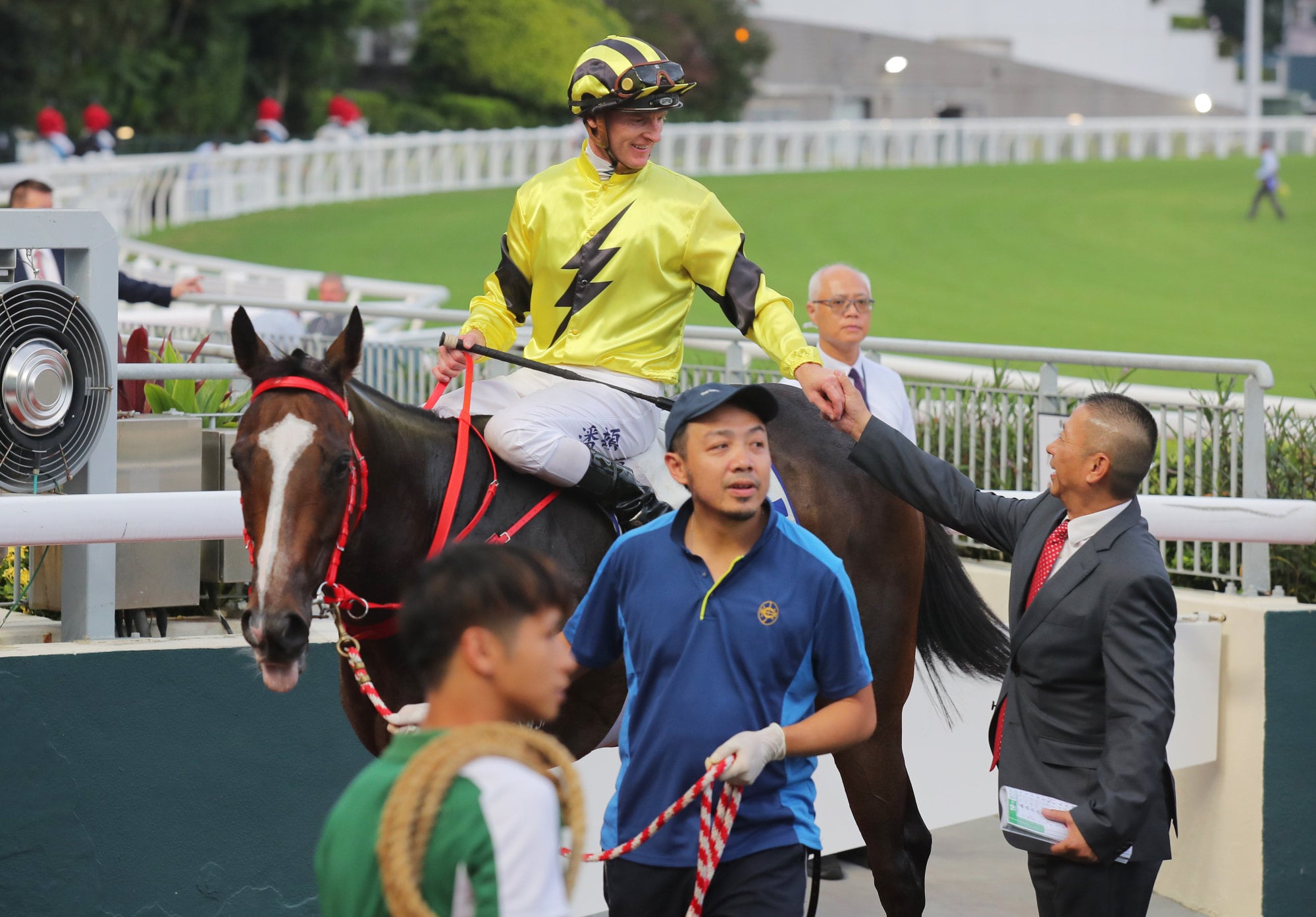 Jockey Zac Purton and trainer Danny Shum celebrate Nyx Gluck’s victory.