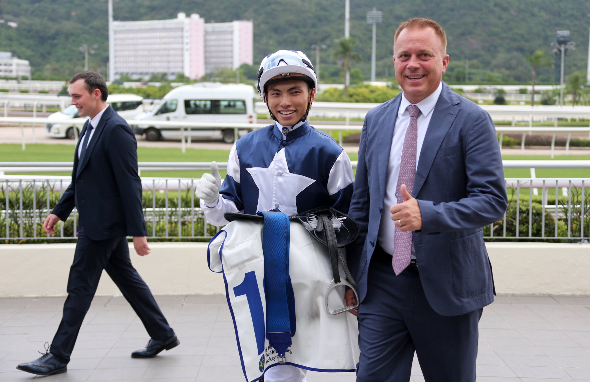 Ellis Wong and trainer Caspar Fownes celebrate Alpha Strike’s win. Ellis Wong and trainer Caspar Fownes celebrate Alpha Strike’s win.