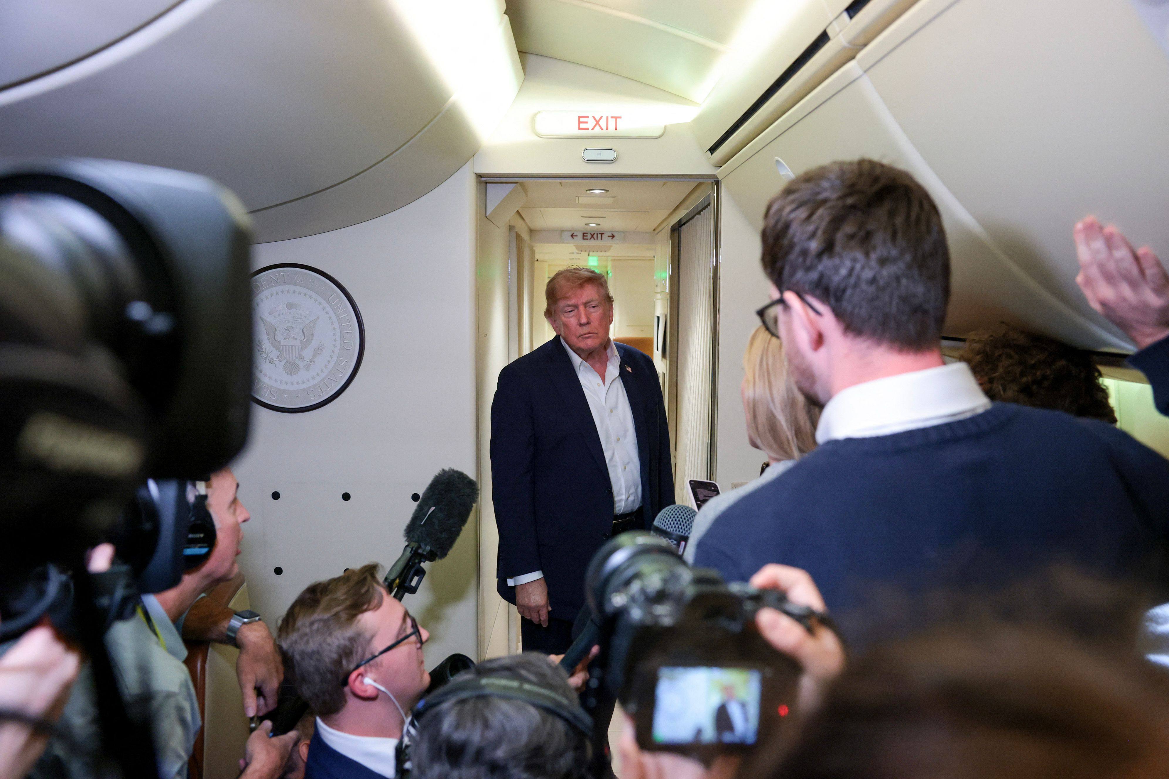 US President Donald Trump speaks to reporters aboard Air Force One while traveling back from Ireland to Joint Base Andrews, Maryland on Sunday. Trump has resisted stirring concerns about AI and has largely embraced AI firms in his second term. Photo: AFP