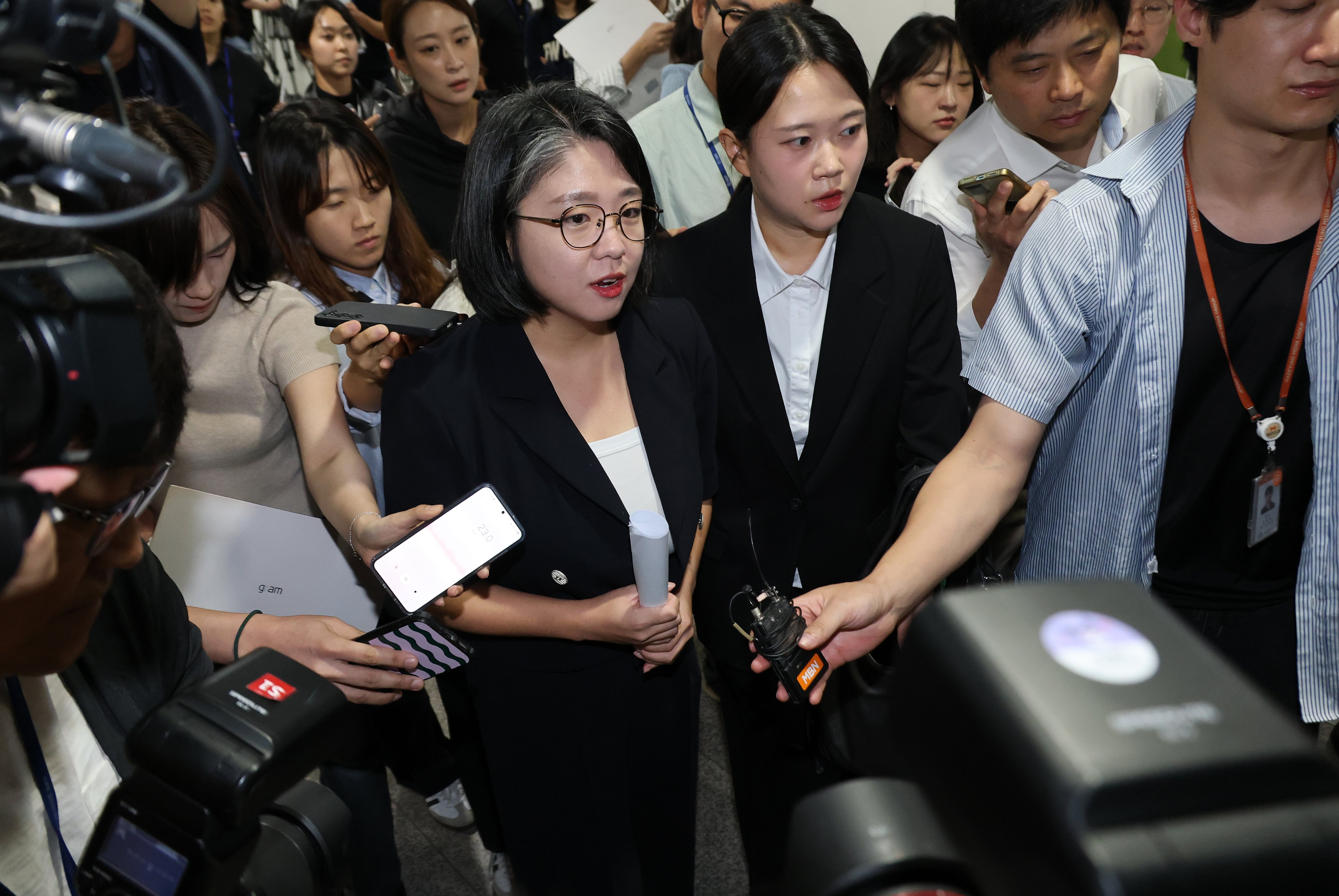 South Korea’s Gender Minister nominee Yong Hye-in (centre) leaves the National Assembly after announcing her withdrawal during a news conference in Seoul on Sunday. Photo: EPA