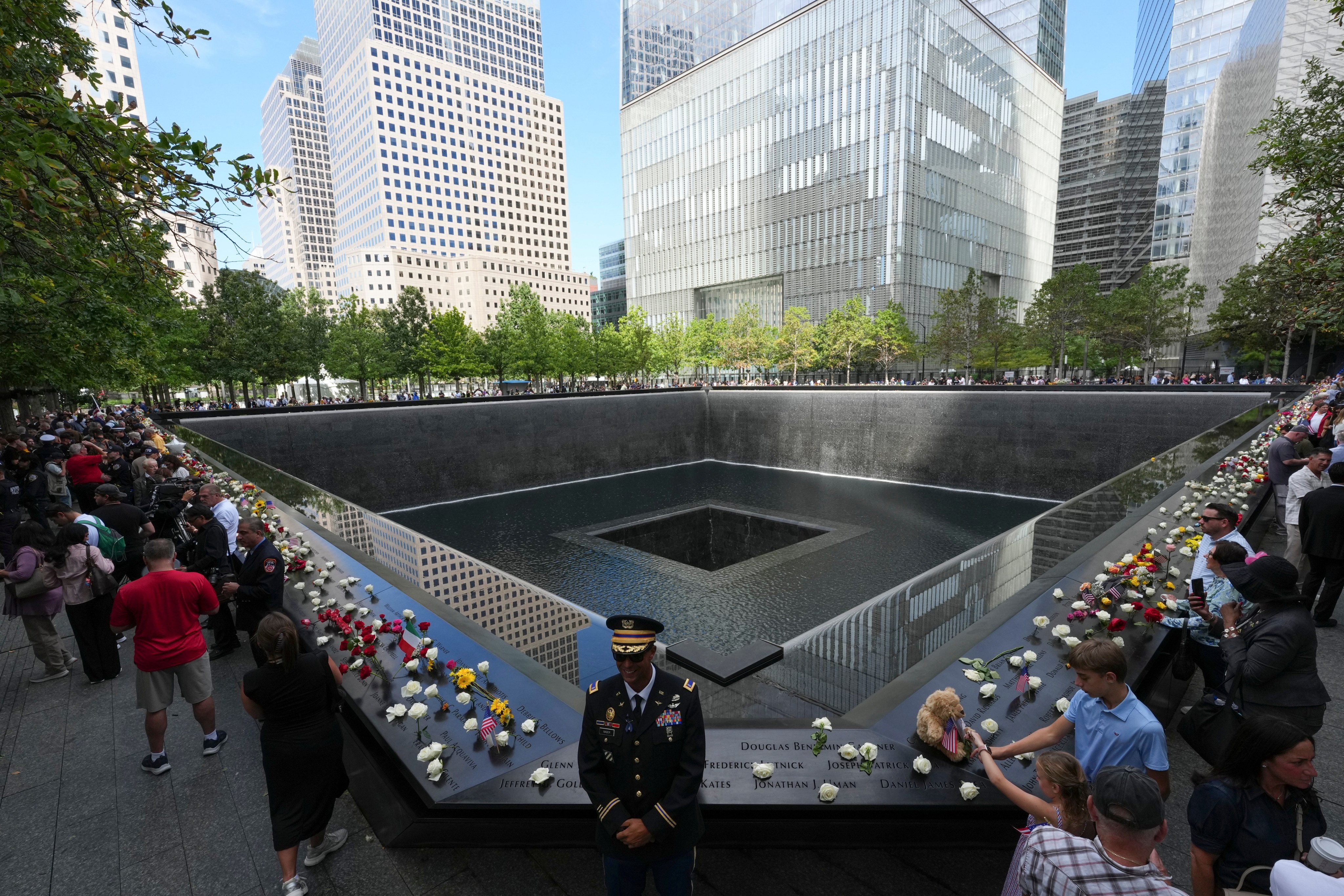Visitors pay respects at the  9/11 memorial in New York on the 25th anniversary of the attacks. Photo: AP