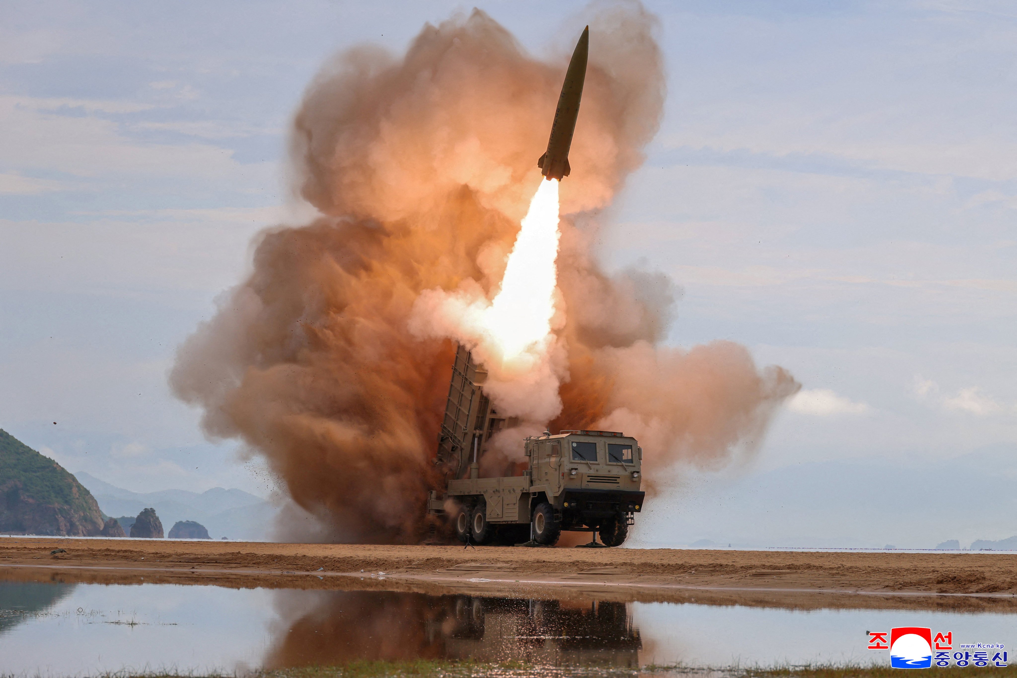A rocket launcher fires a missile during tests in North Korea on June 25. Photo: KCNA / Reuters