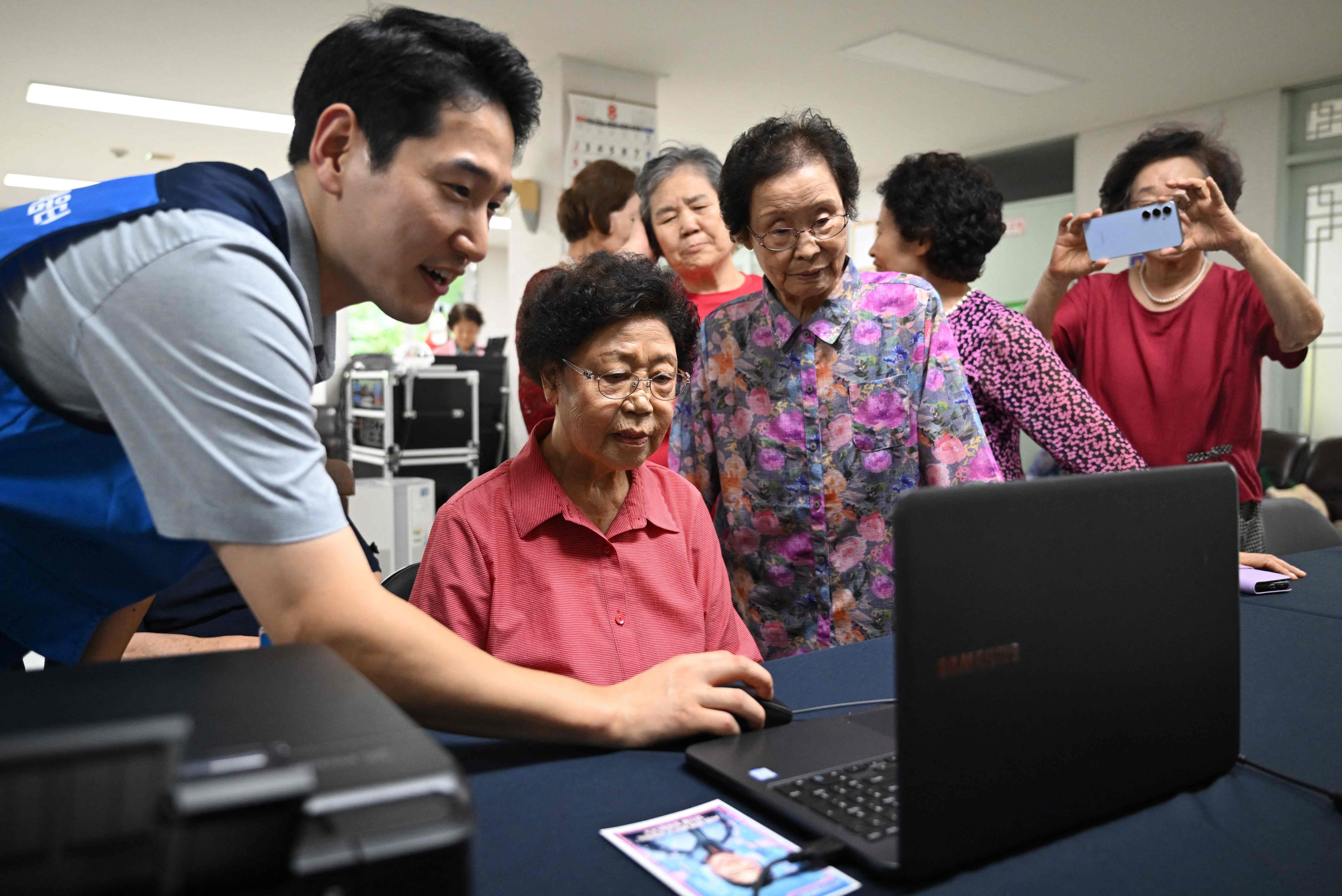 Elderly people attending a digital training at a community centre in Suwon, South Korea in August. Age gaps in digital literacy are a global concern, but the gulf has widened in the fast-aging country, prompting national campaigns. Photo: AFP