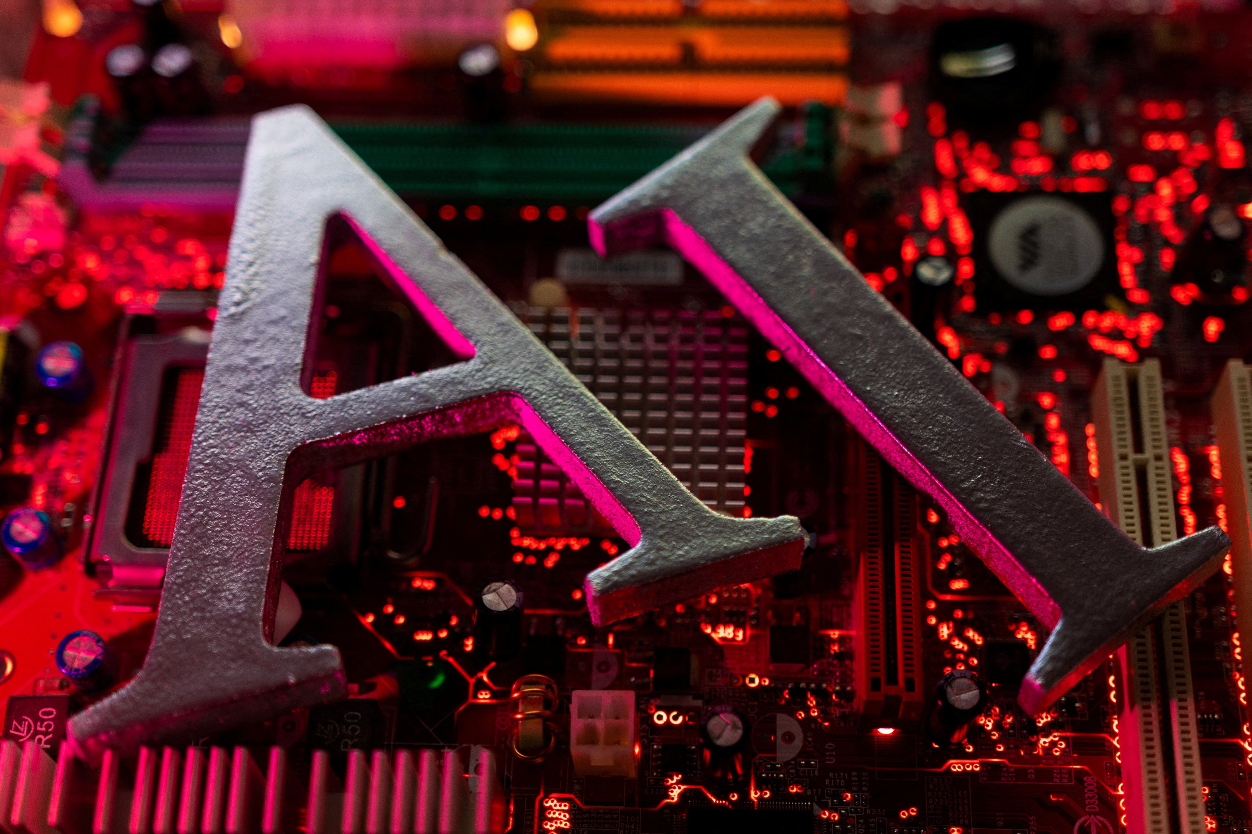 FILE PHOTO: AI (Artificial Intelligence) letters are placed on computer motherboard in this illustration taken, June 23, 2023. REUTERS/Dado Ruvic/Illustration/File Photo