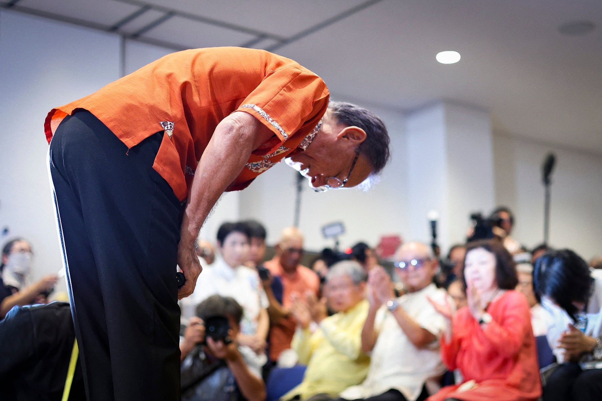 Denny Tamaki bows to his supporters in Naha, Okinawa prefecture, after reports projected his defeat in Okinawa’s gubernatorial election on September 13, 2026. Photo: AFP Denny Tamaki bows to his supporters in Naha, Okinawa prefecture, after reports projected his defeat in Okinawa’s gubernatorial election on September 13, 2026. Photo: AFP