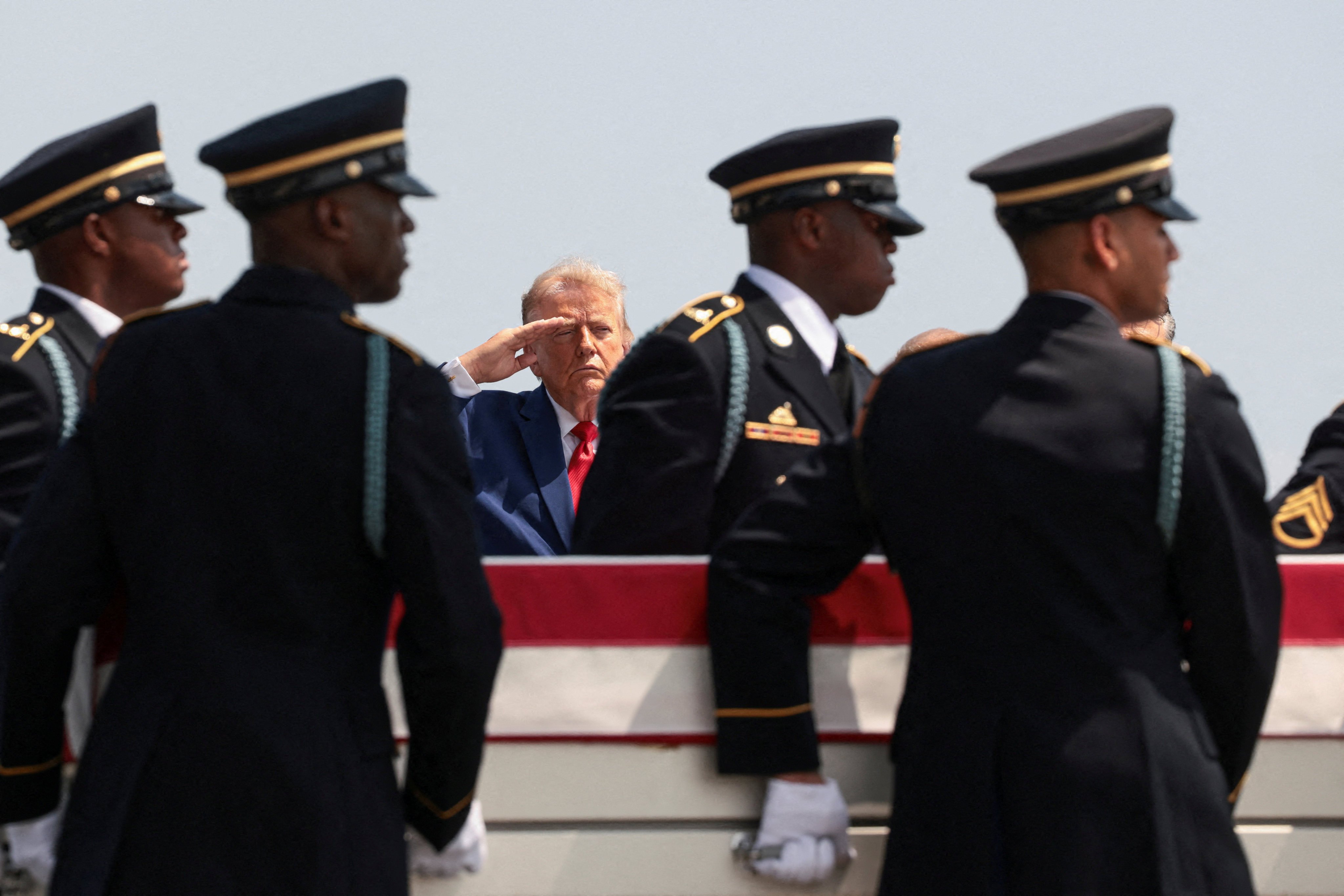 US President Donald Trump salutes during a dignified transfer ceremony for dead US personnel. Photo: Reuters