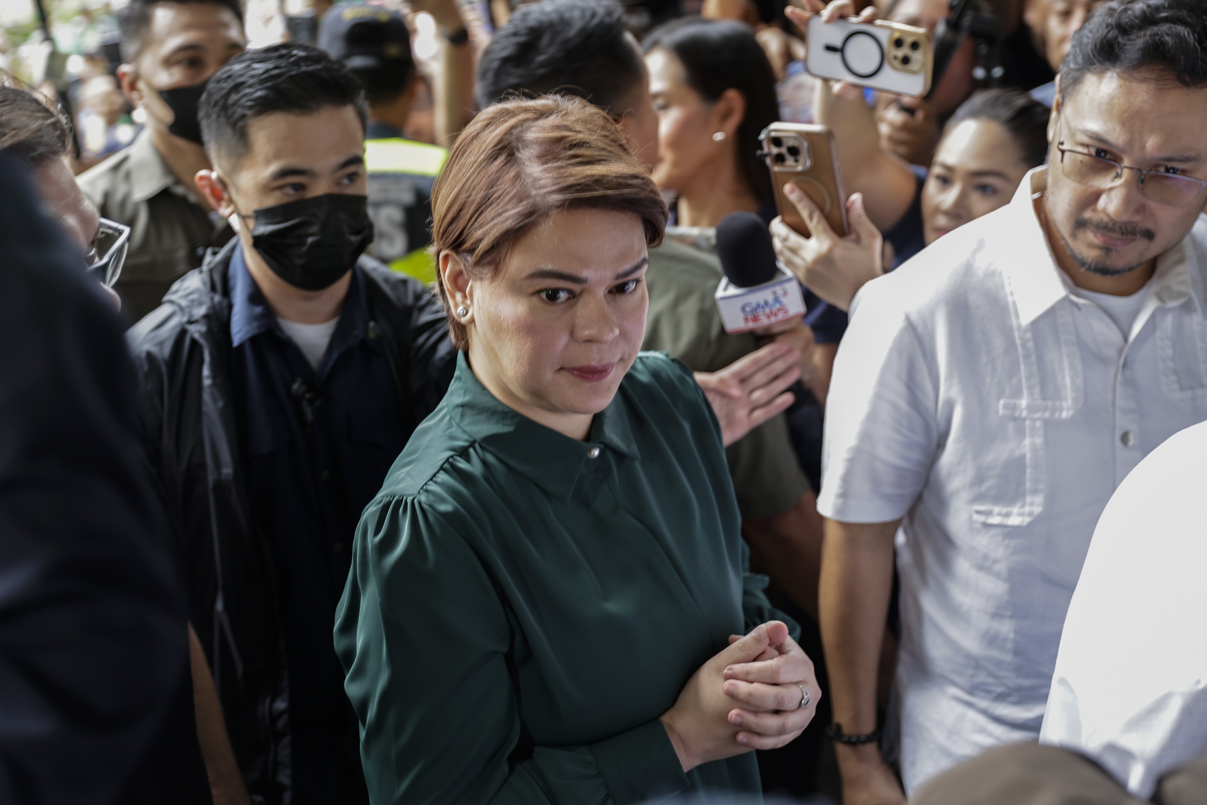 Philippine Vice-President Sara Duterte-Carpio (centre) arrives at the Hall of Justice for a scheduled arraignment in Quezon City, Metro Manila, on Friday. Photo: EPA