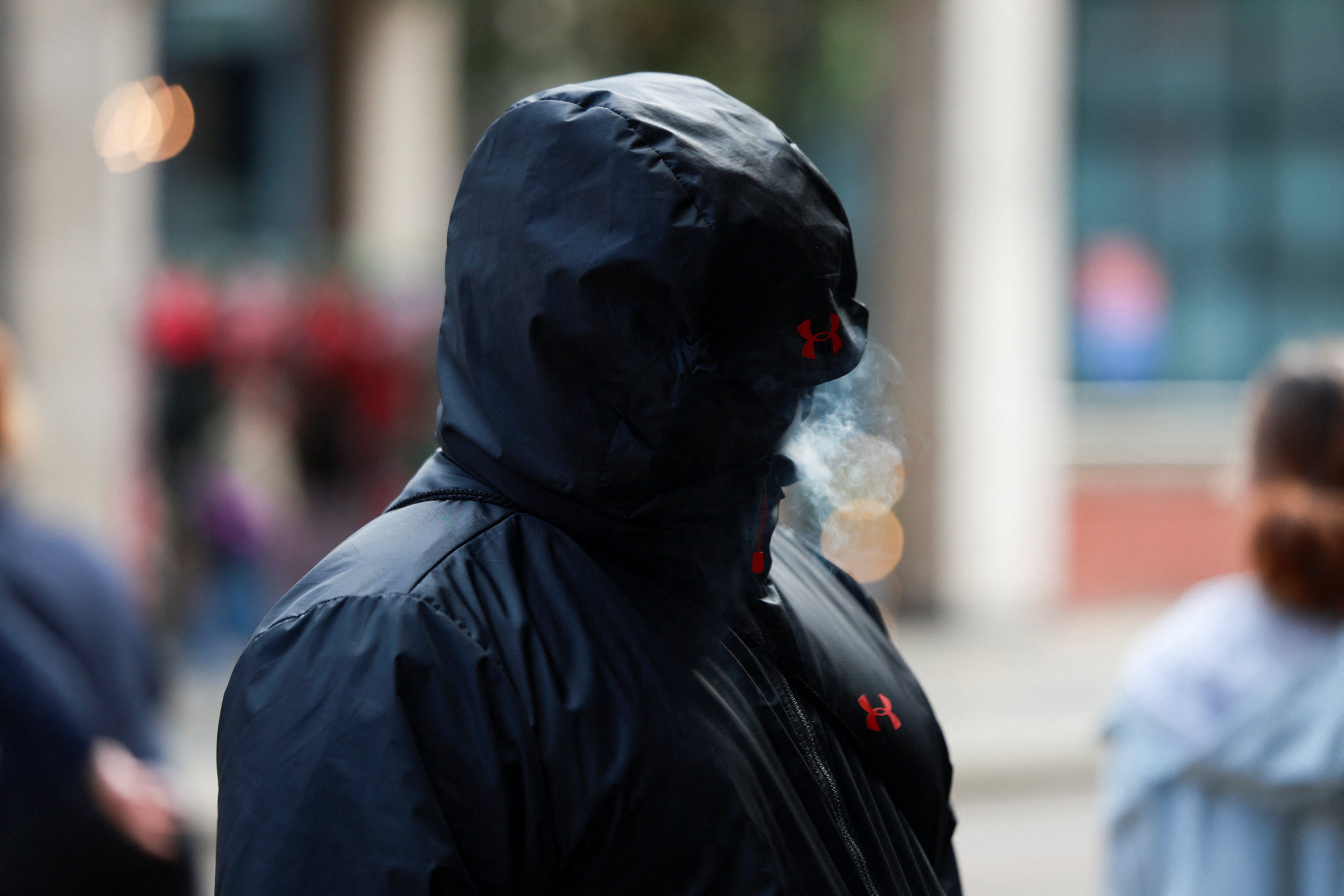 One of the 12 co-defendants outside the court. Photo: Reuters