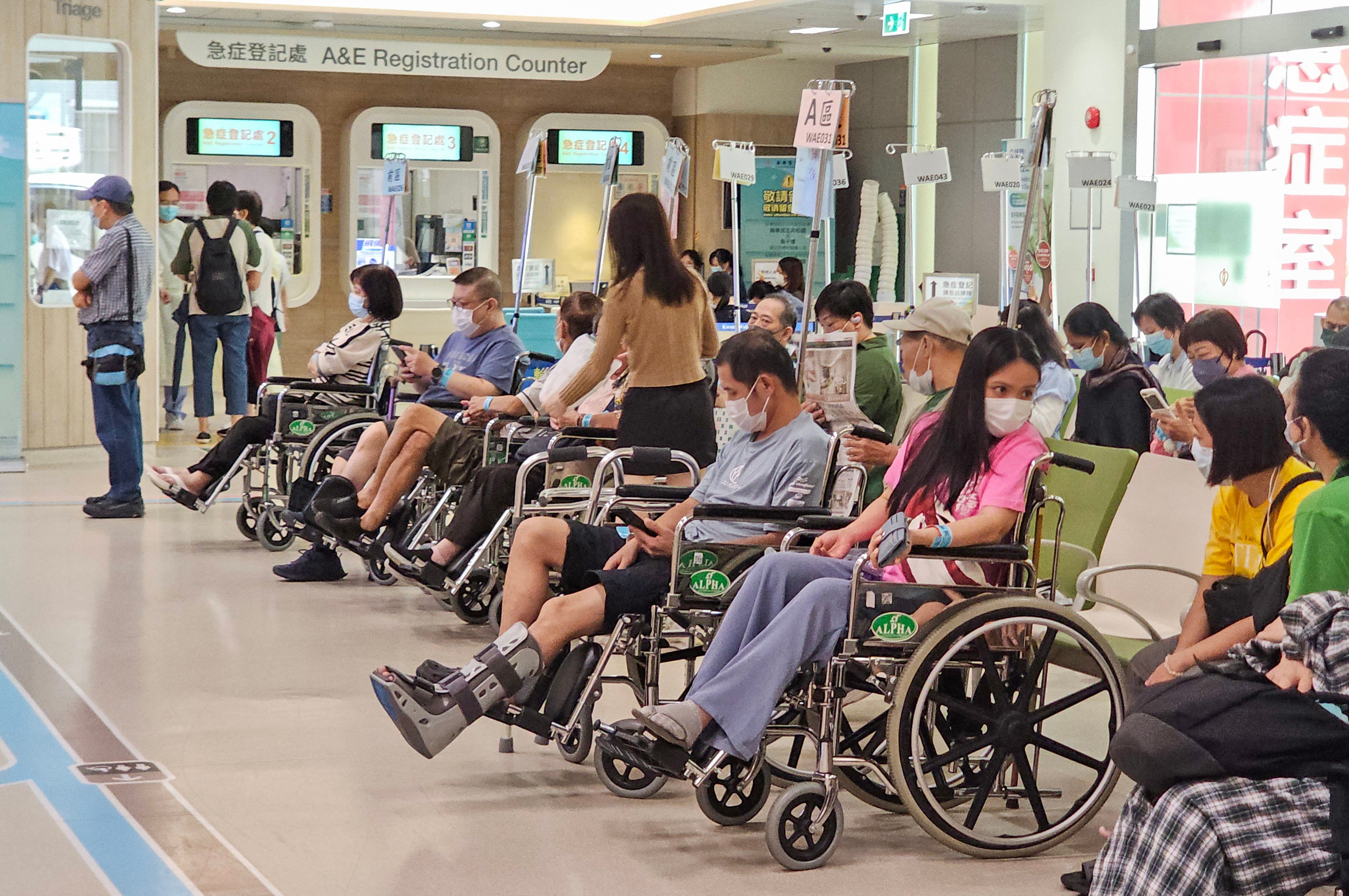 People wait at the Accident and Emergency ward in Kwong Wah Hospital. Hong Kong has long relied on a combined public-private model for its healthcare system, but aims to slash government subsidies. Photo: Edmond So