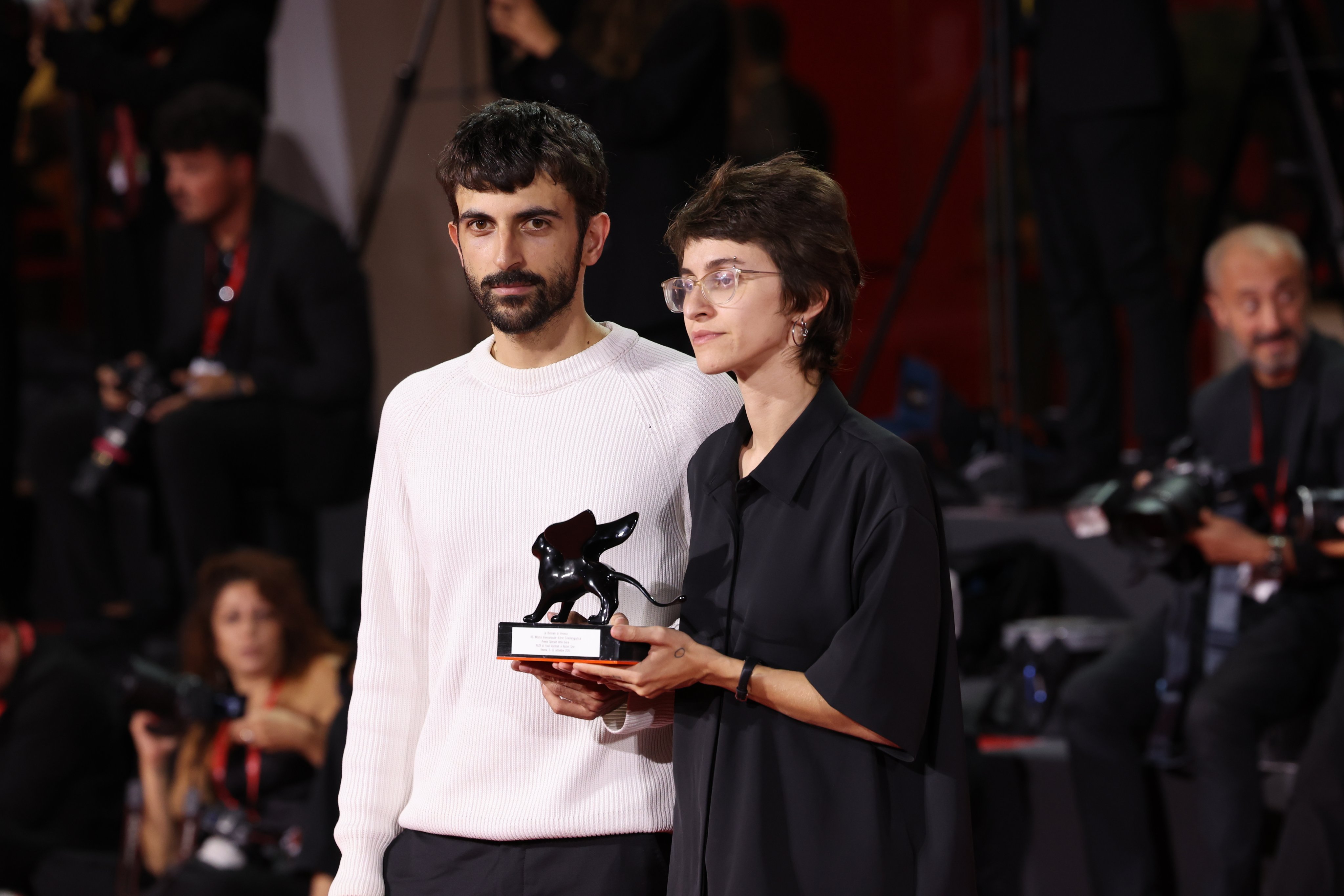 Israeli filmmakers Rachel Szor (right) and Yuval Abraham on the red carpet with their special jury prize for the documentary NAZA at the Venice International Film Festival in Venice, Italy on Saturday. Photo: EPA