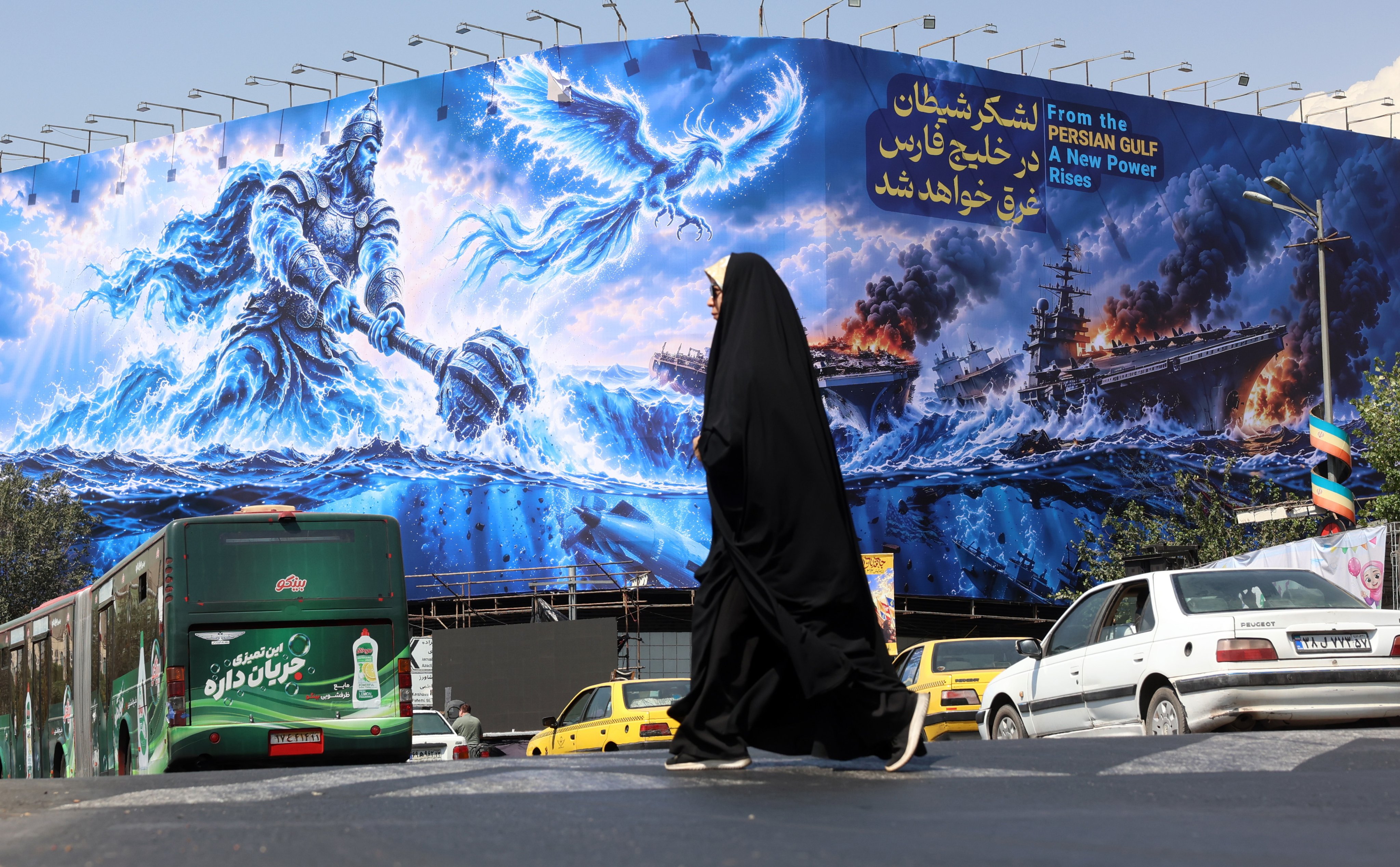 A propaganda billboard in Tehran depicting sinking US warships in the Persian Gulf. Photo: EPA
