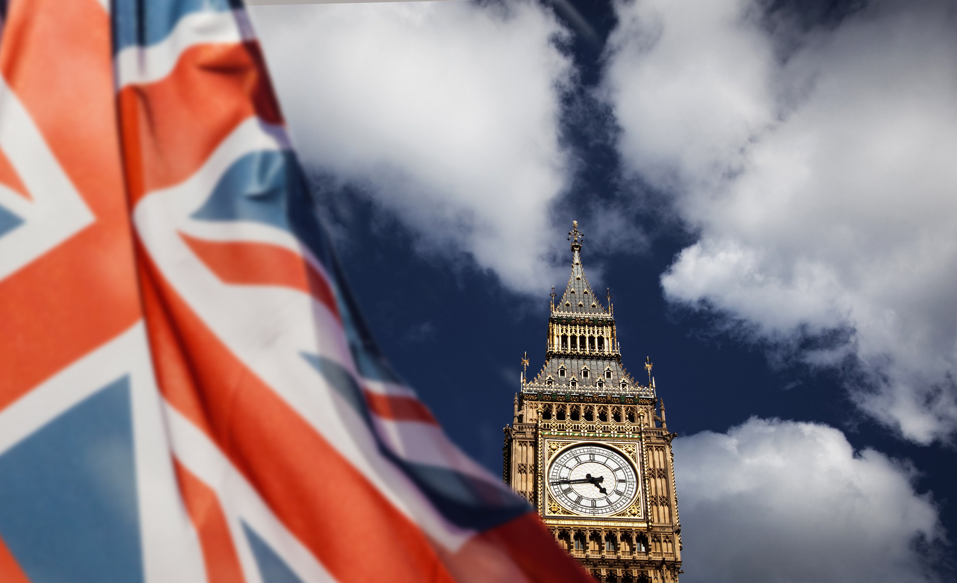 A Union flag flies in front of Big Ben and the Houses of Parliament in London. Photo: Shutterstock