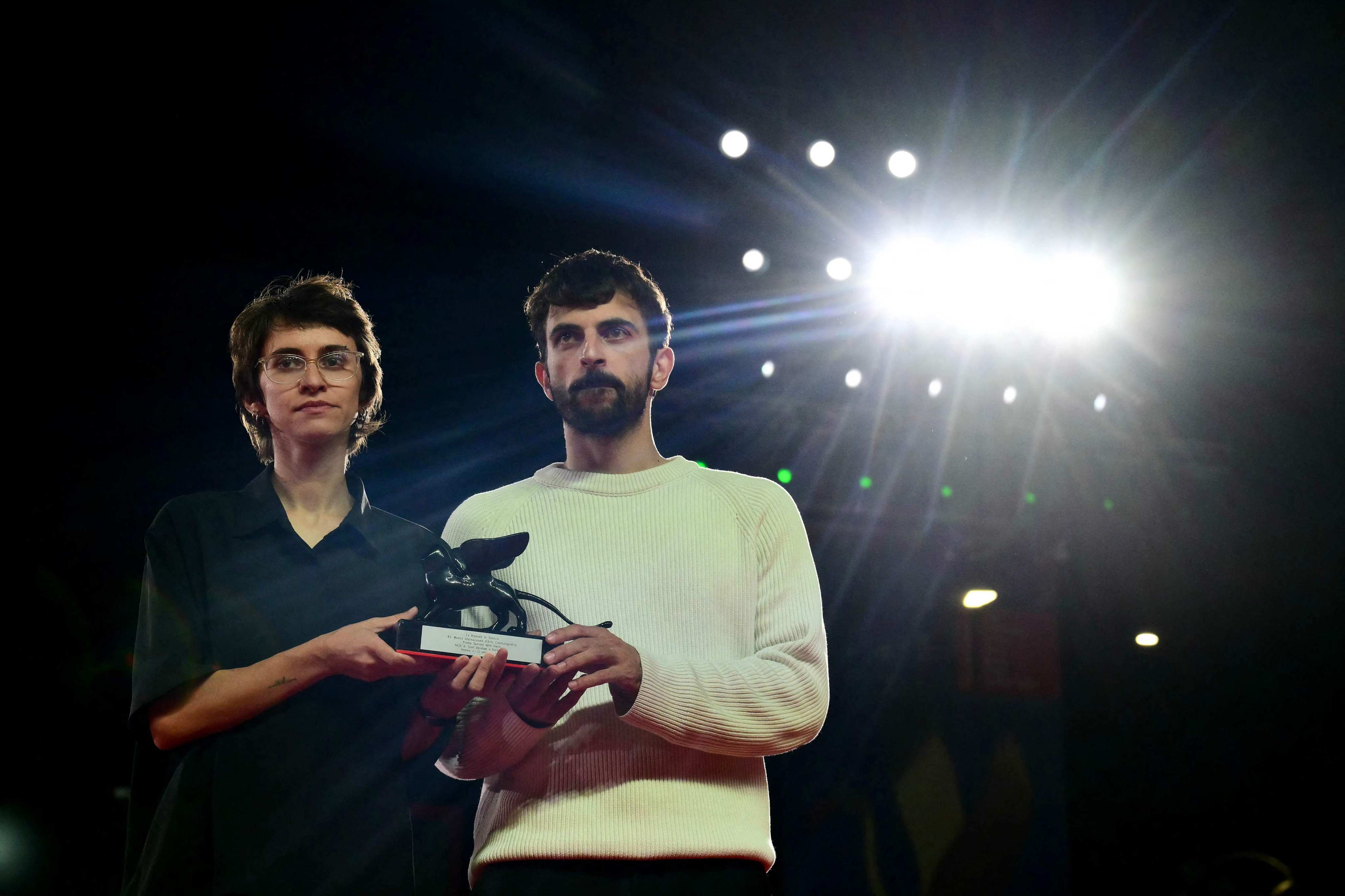 Directors Rachel Szor and Yuval Abraham pose with the Special Jury Prize for 'NAZA' at the 83rd Venice Film Festival. Photo: AFP