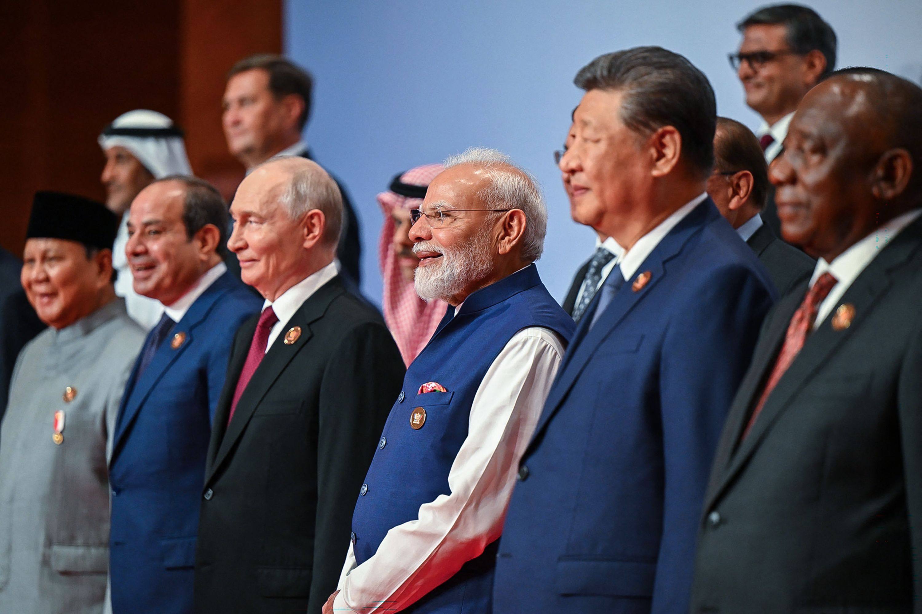 Russia’s President Vladimir Putin (third left), India’s Prime Minister Narendra Modi (third right) and China’s President Xi Jinping (second right) posing with other leaders for a photo during the BRICS Summit in New Delhi on Sunday. Photo: AFP/Indian Press Information Bureau