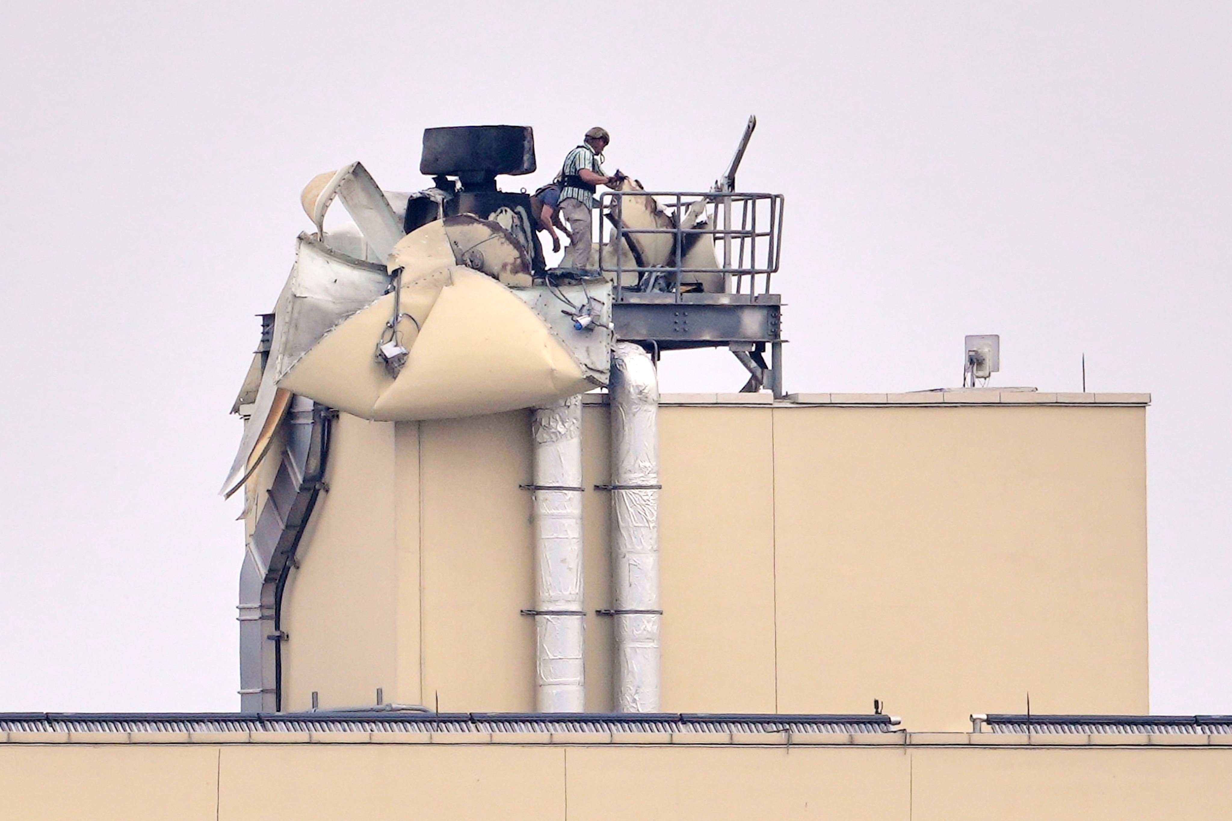 US embassy personnel inspect structural damage on March 14 following a bombing in Baghdad, Iraq. Photo: AP