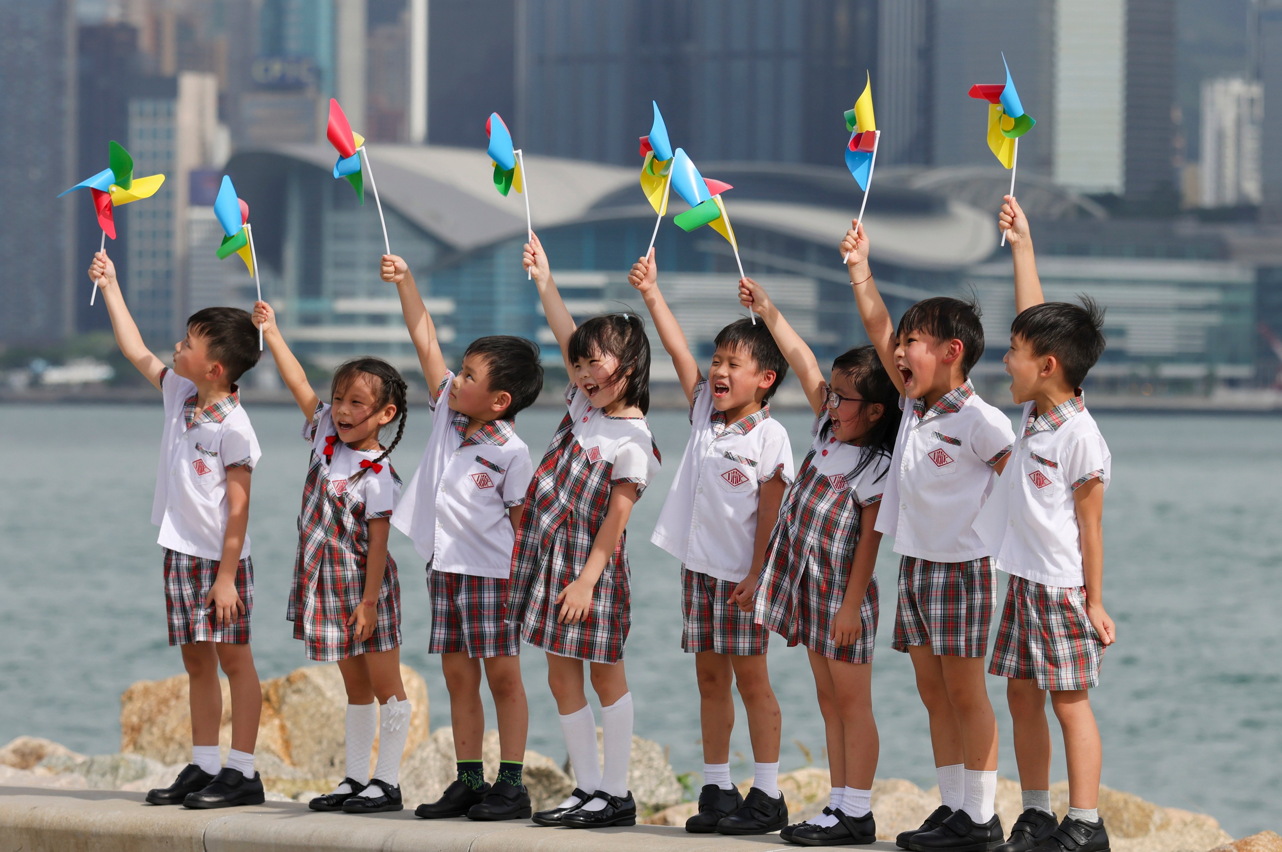 Kids have graduation photos at West Kowloon Cultural District. Photo: Nora Tam