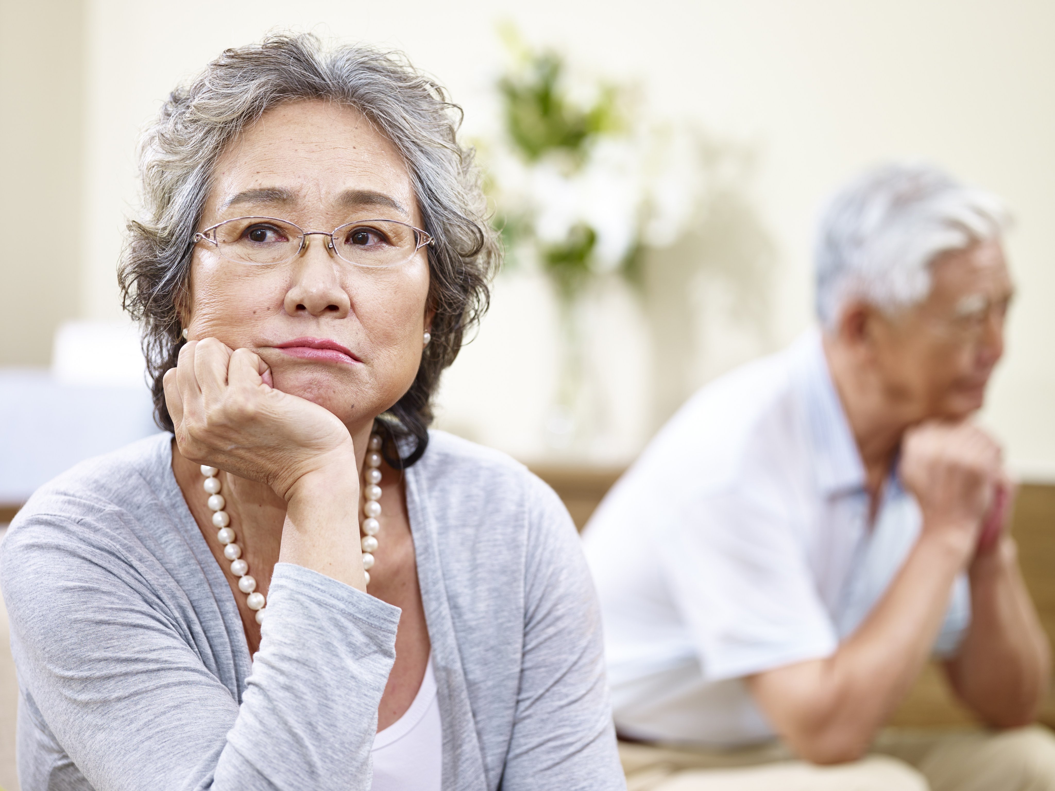 A senior couple sits on couch at home, angry at each other. A 90-year-old man is denied the maintenance he sought as an incapacitated former husband under the Women’s Charter. Photo: Shutterstock