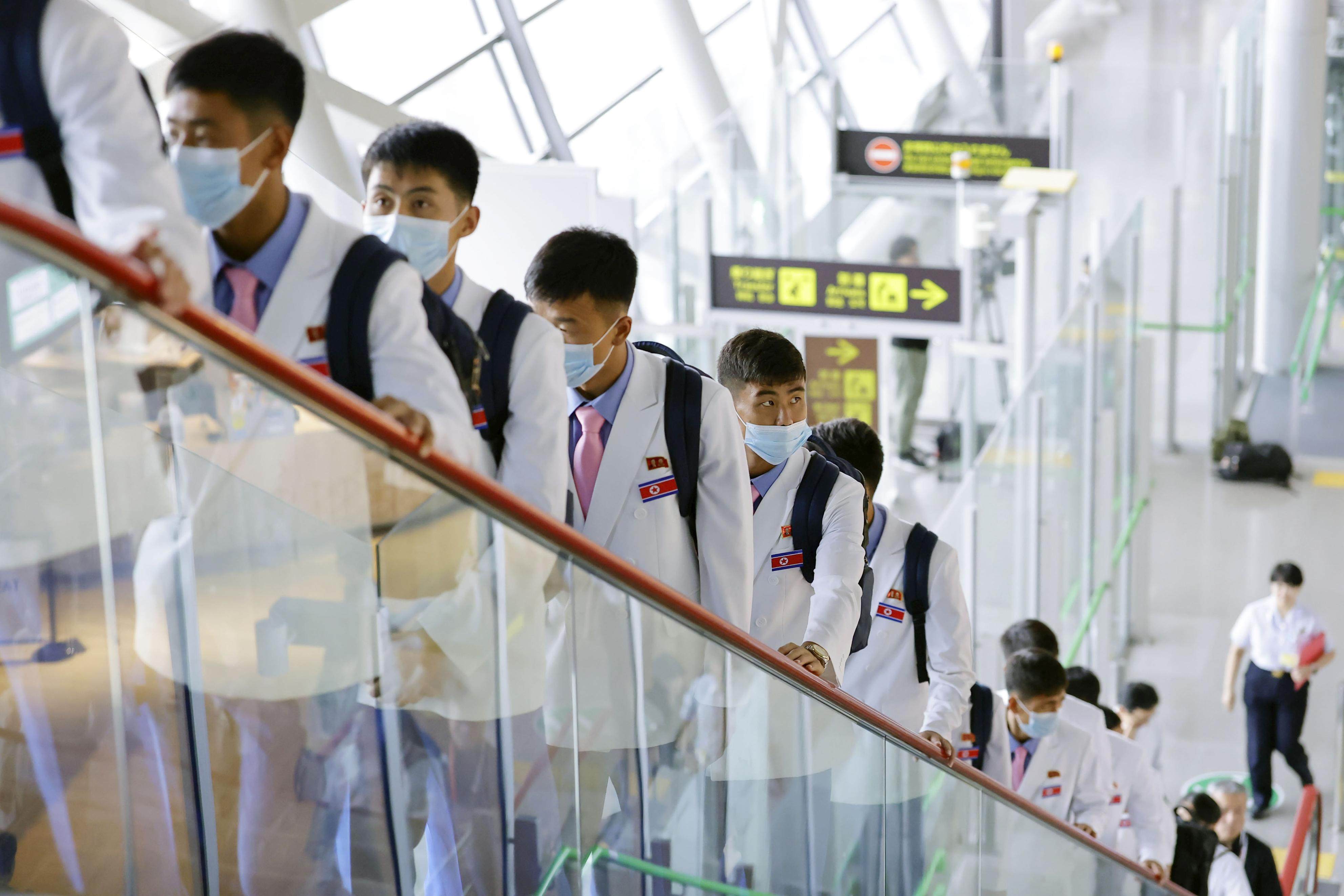 North Korean athletes and officials arrive at Kansai International Airport in Osaka Prefecture, Japan on Friday, ahead of the Aichi-Nagoya Asian Games. Photo: Kyodo