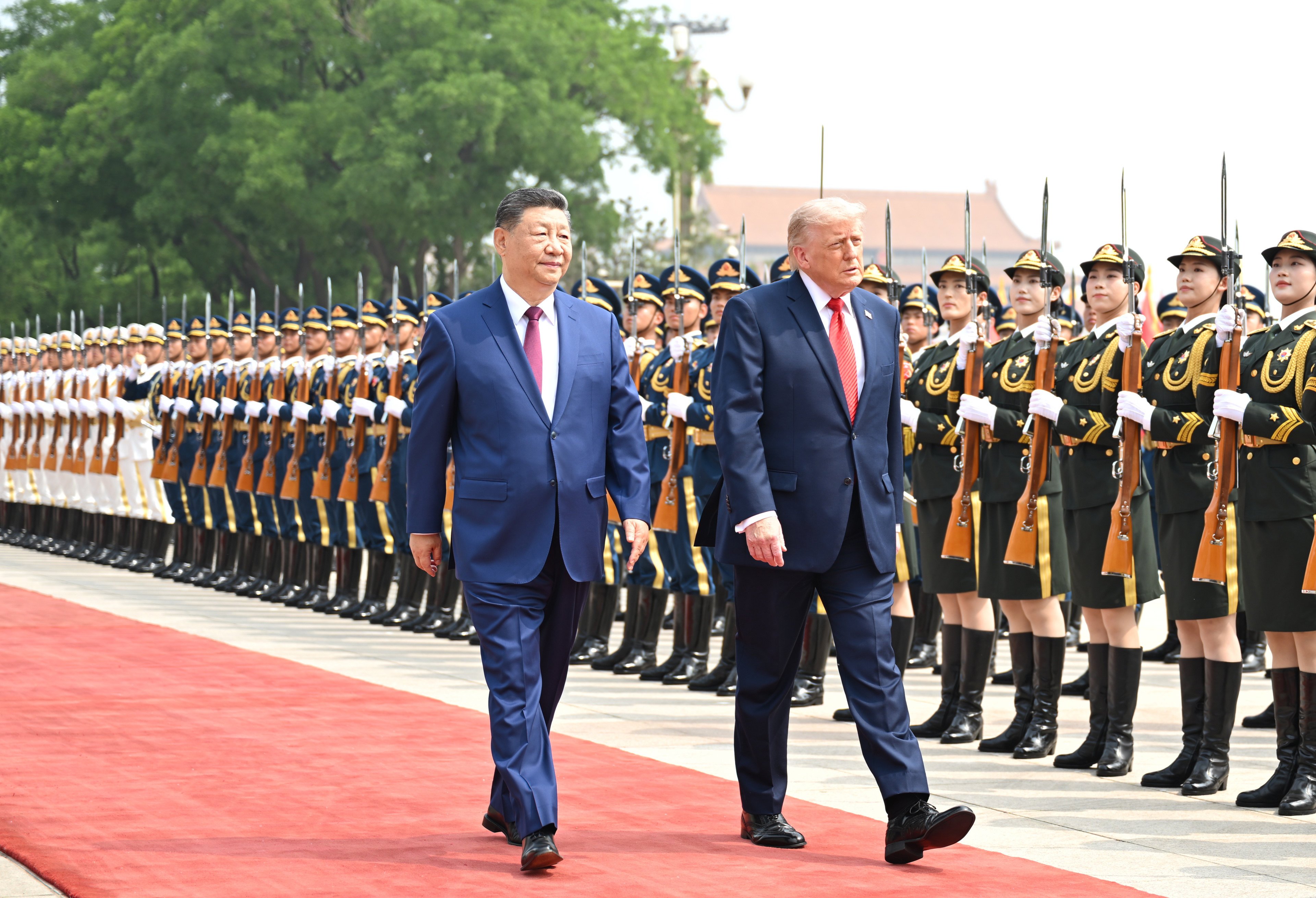 Chinese President Xi Jinping (left) walks alongside US President Donald Trump (right) during a welcome ceremony for the US leader outside the Great Hall of the People in Beijing on May 14, 2026. Photo: Xinhua