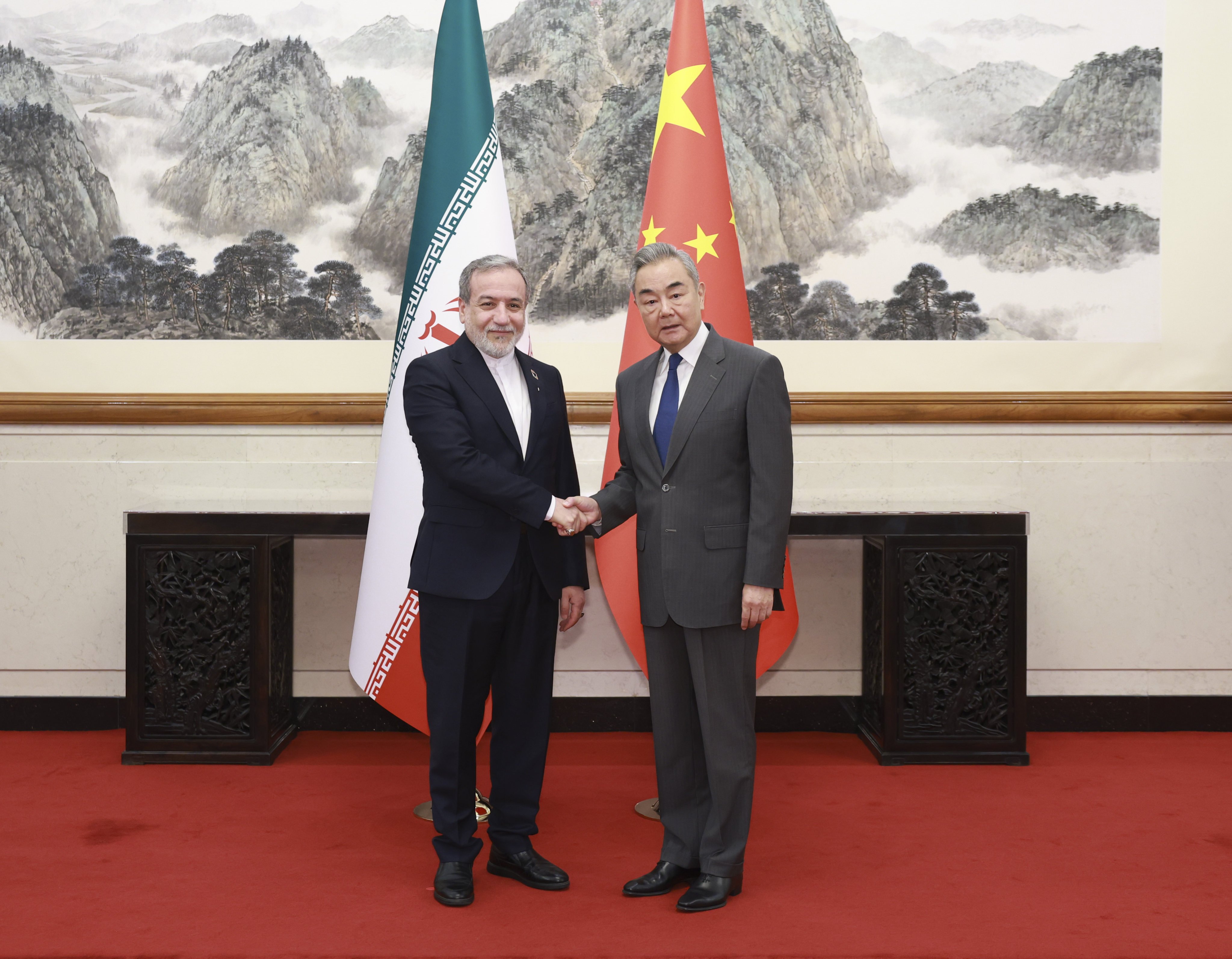 Chinese Minister of Foreign Affairs Wang Yi (right) urged all parties to take effective measures to reopen the Strait of Hormuz “at the earliest opportunity”. Photo: Xinhua