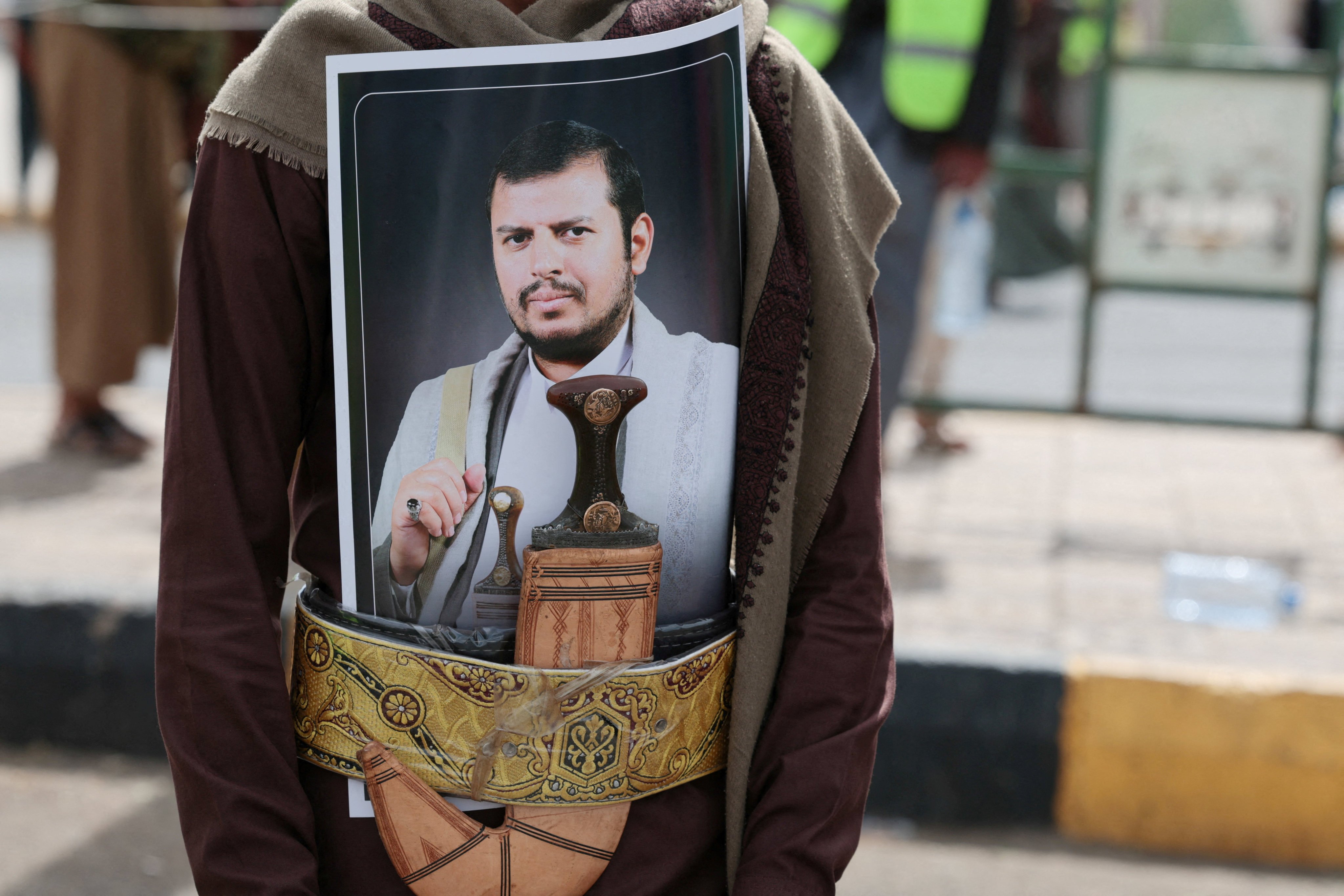 A Houthi supporter sports a poster of the group’s leader in his dagger’s belt in Sanaa, Yemen, on July 17. Photo: Reuters