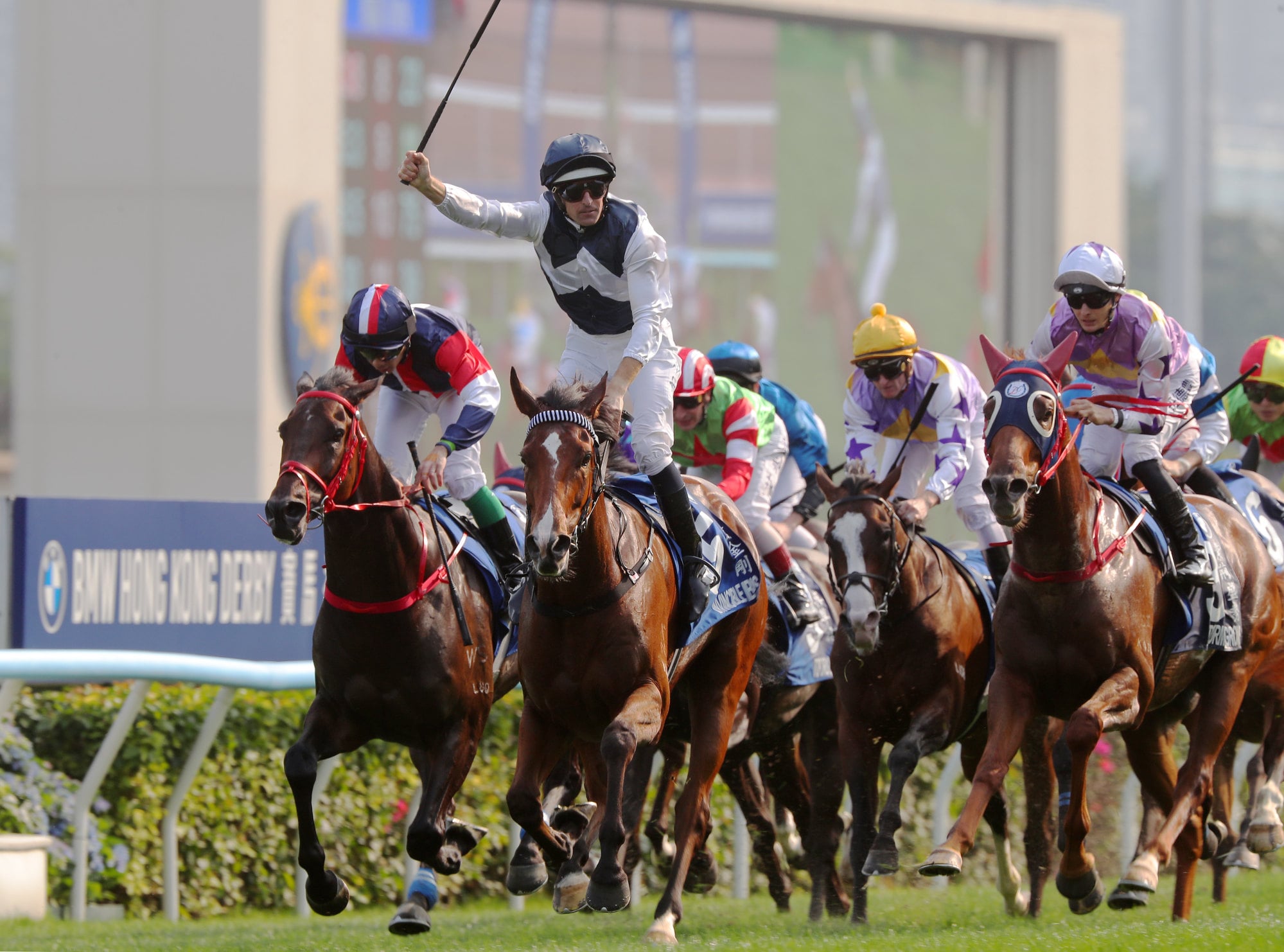 Hugh Bowman celebrates his Hong Kong Derby triumph on Invincible Ibis earlier this year. Hugh Bowman celebrates his Hong Kong Derby triumph on Invincible Ibis earlier this year.