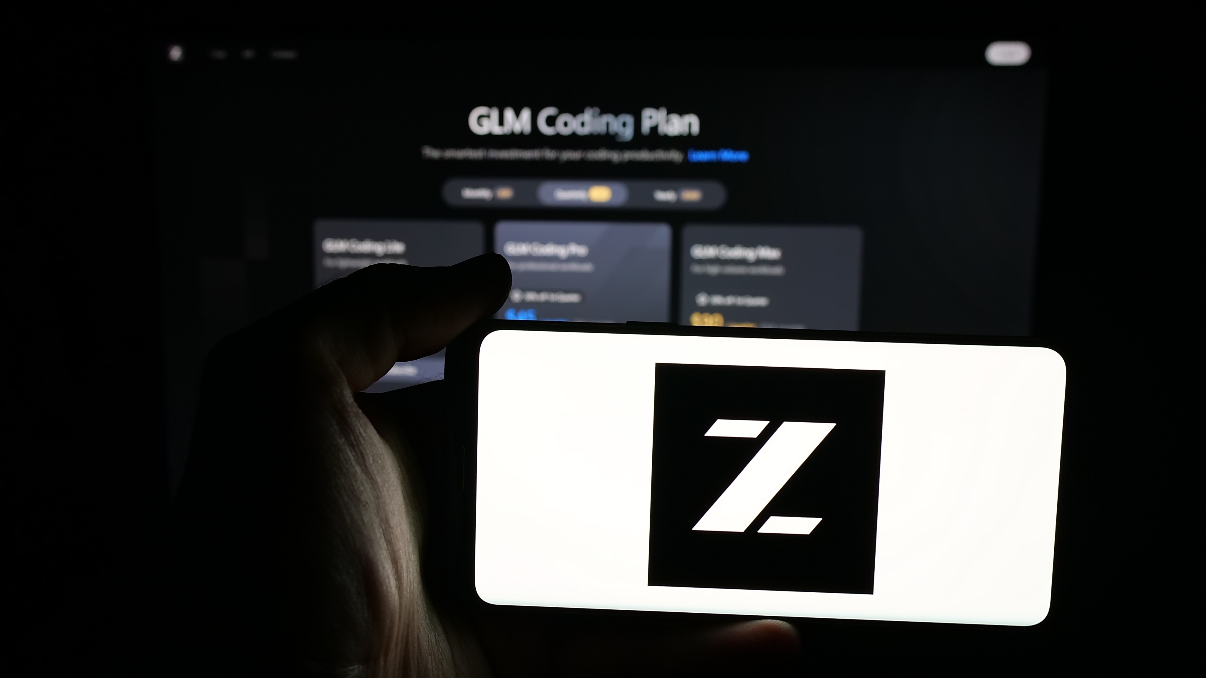 A person holds a mobile phone displaying the logo of Chinese artificial intelligence firm Z.ai. Photo: Shutterstock