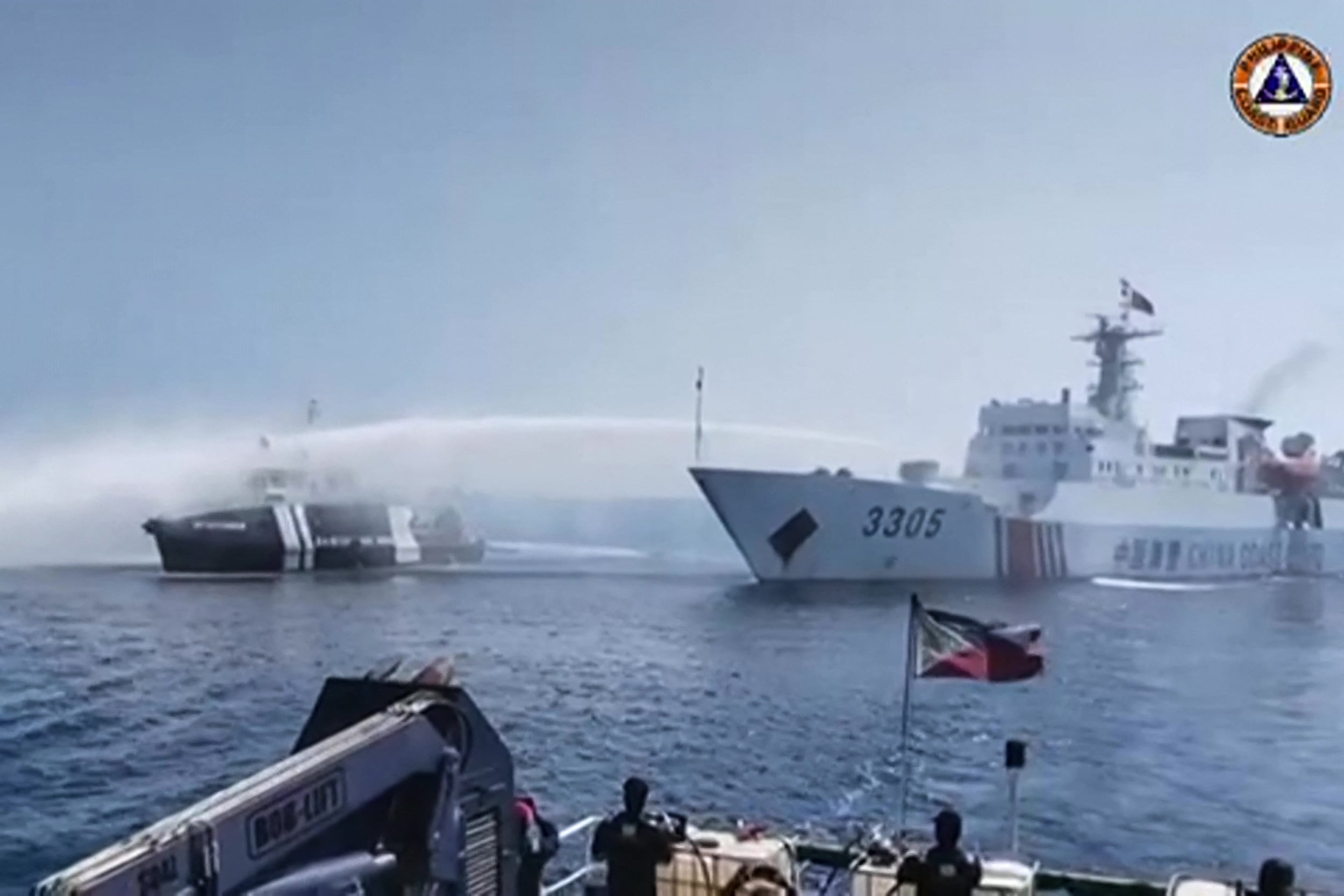 A China Coast Guard ship (right) uses a water cannon on a Philippine Bureau of Fisheries and Aquatic Resources vessel near Scarborough Shoal in 2023. Photo: Philippine Coast Guard vias AFP