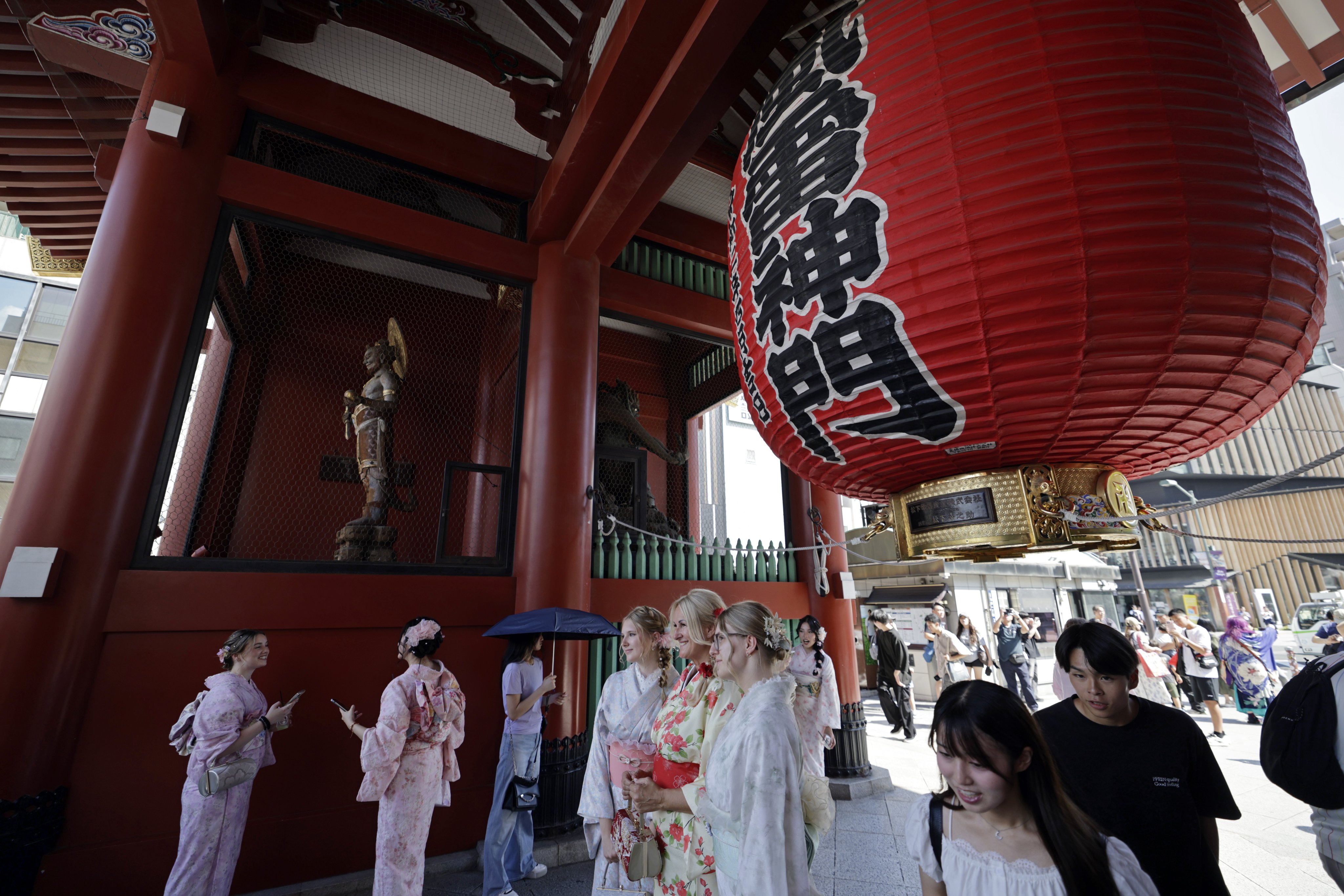 Tourists visit the Sensoji Temple in Tokyo on August 19. Photo: EPA