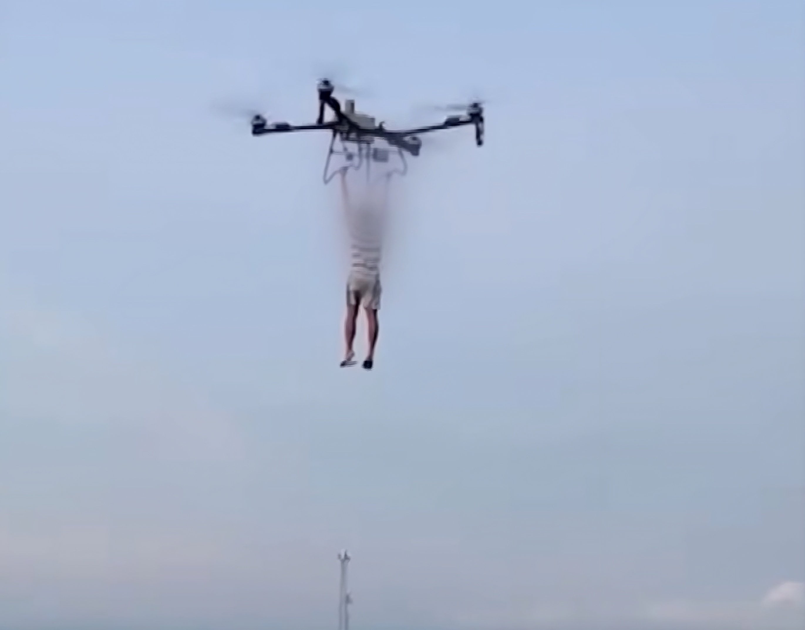 A person dangles from a drone in this still from footage obtained by Korean broadcaster JTBC allegedly showing a practice run for Park Wang-yeol’s escape plot from Philippine prison. Photo: YouTube/JTBC_News
