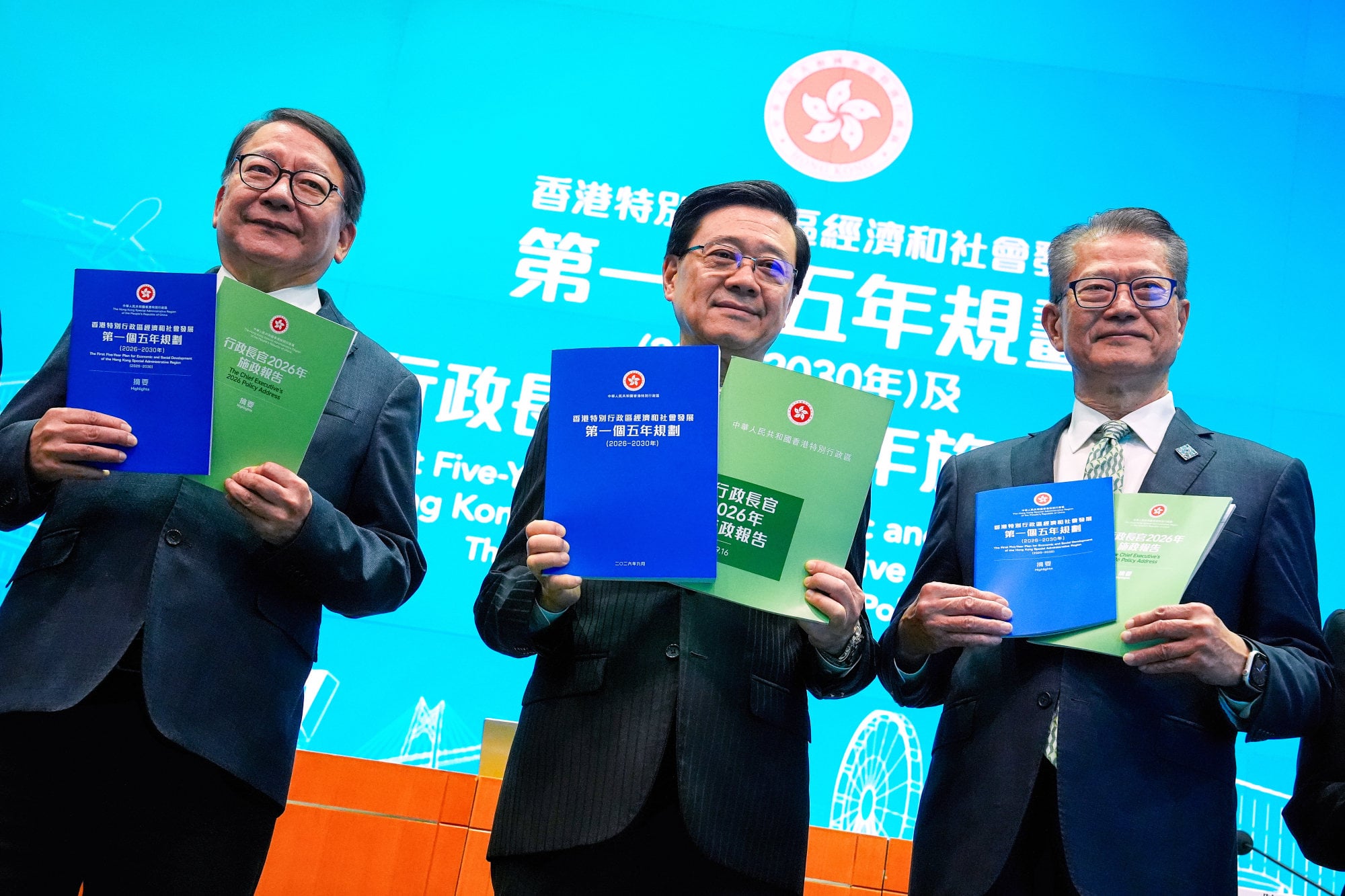 Chief Executive Lee (centre) stands alongside Chief Secretary Eric Chan Kwok-ki (left) and Financial Secretary Paul Chan Mo-po after delivering the five-year plan and the policy address. Photo: Elson Li Chief Executive Lee (centre) stands alongside Chief Secretary Eric Chan Kwok-ki (left) and Financial Secretary Paul Chan Mo-po after delivering the five-year plan and the policy address. Photo: Elson Li