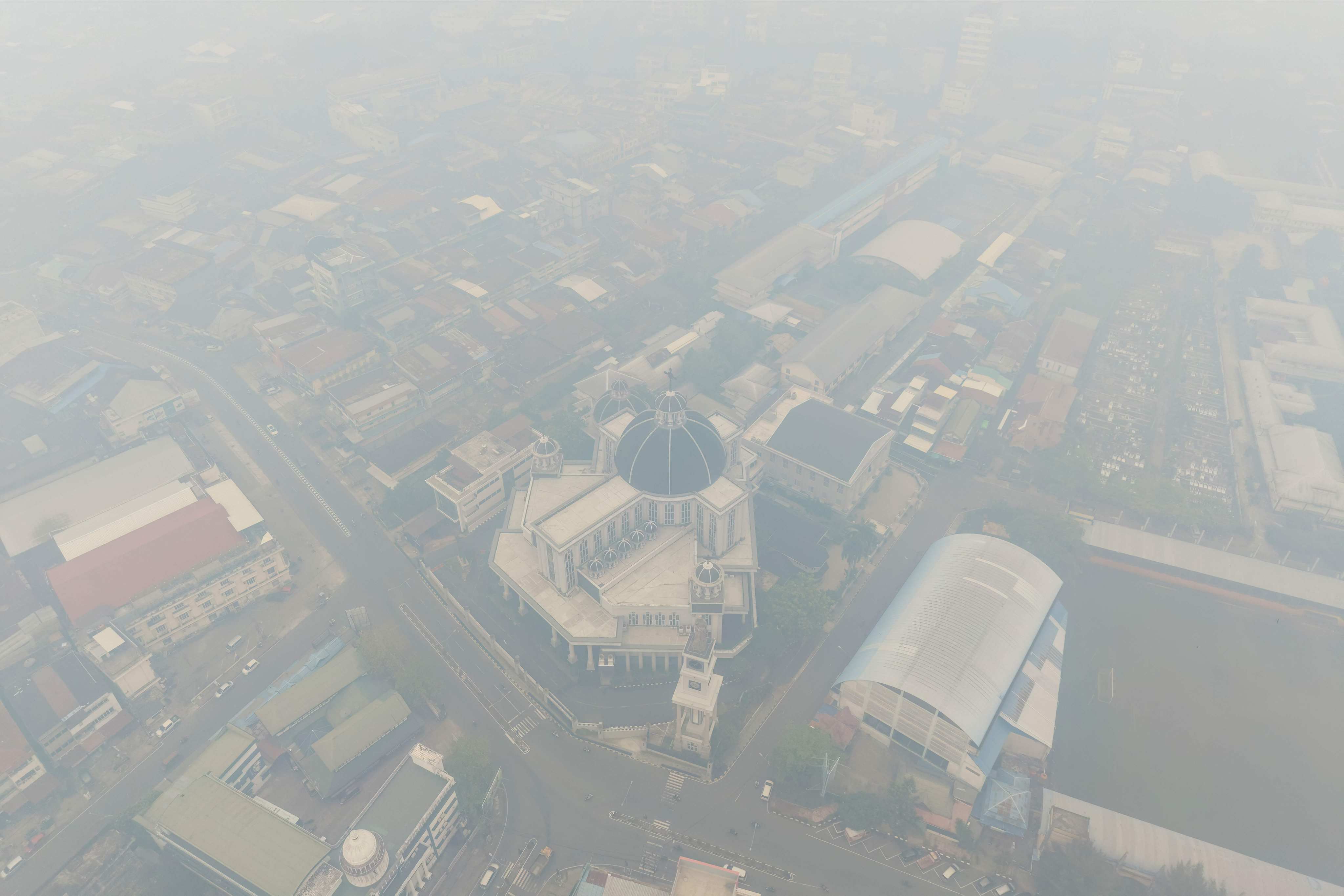 Haze from forest fires shrouds the Cathedral Church in the city of Pontianak, West Kalimantan, on September 7. Photo: AFP