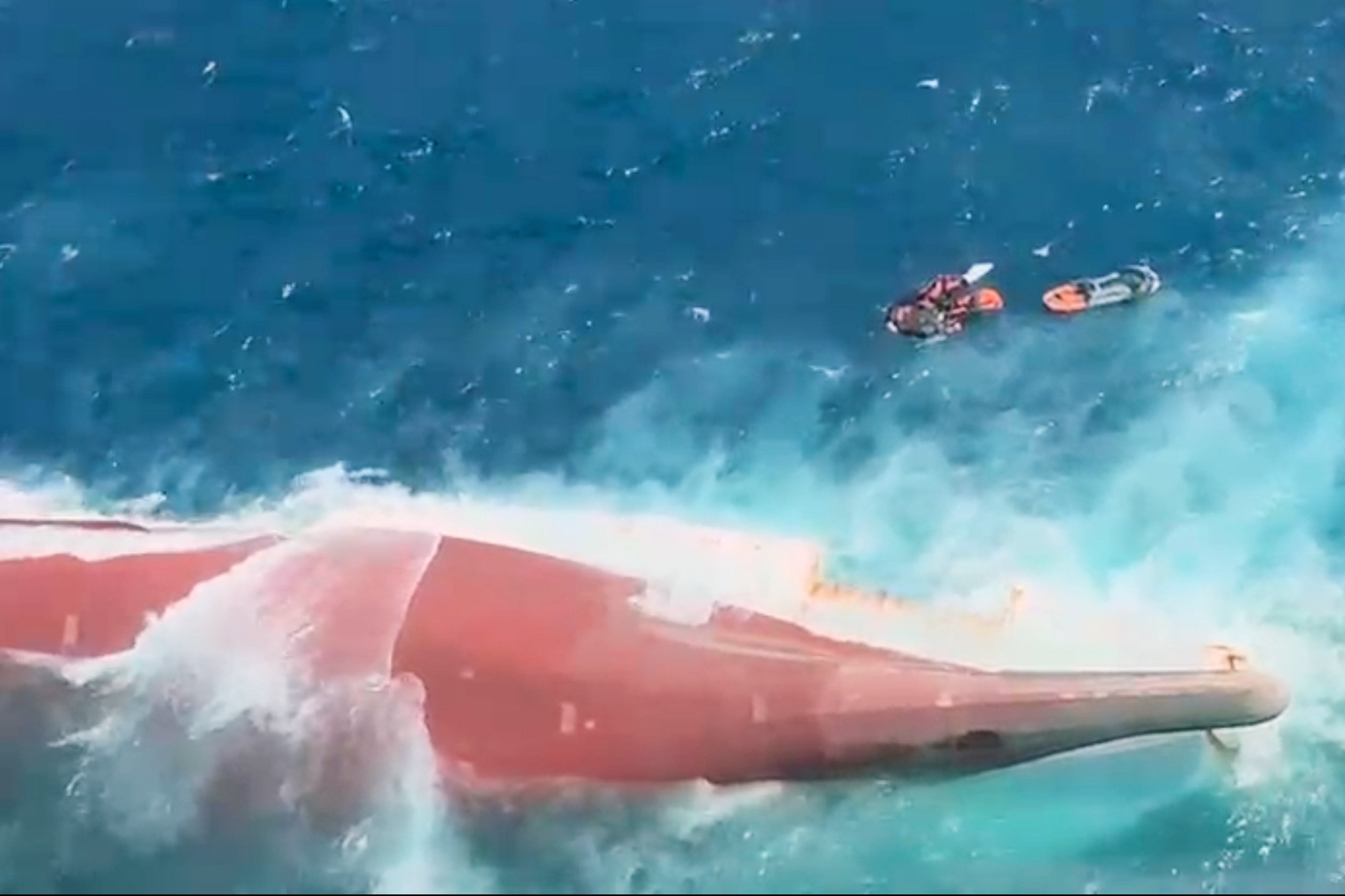 A video image released by Indonesia’s National Search and Rescue Agency (BASARNAS) shows the bottom of passenger ferry Virgo Transport 8 is seen above the water after it overturned in bad weather in the Java Sea on Sunday. Photo: BASARNAS via AP