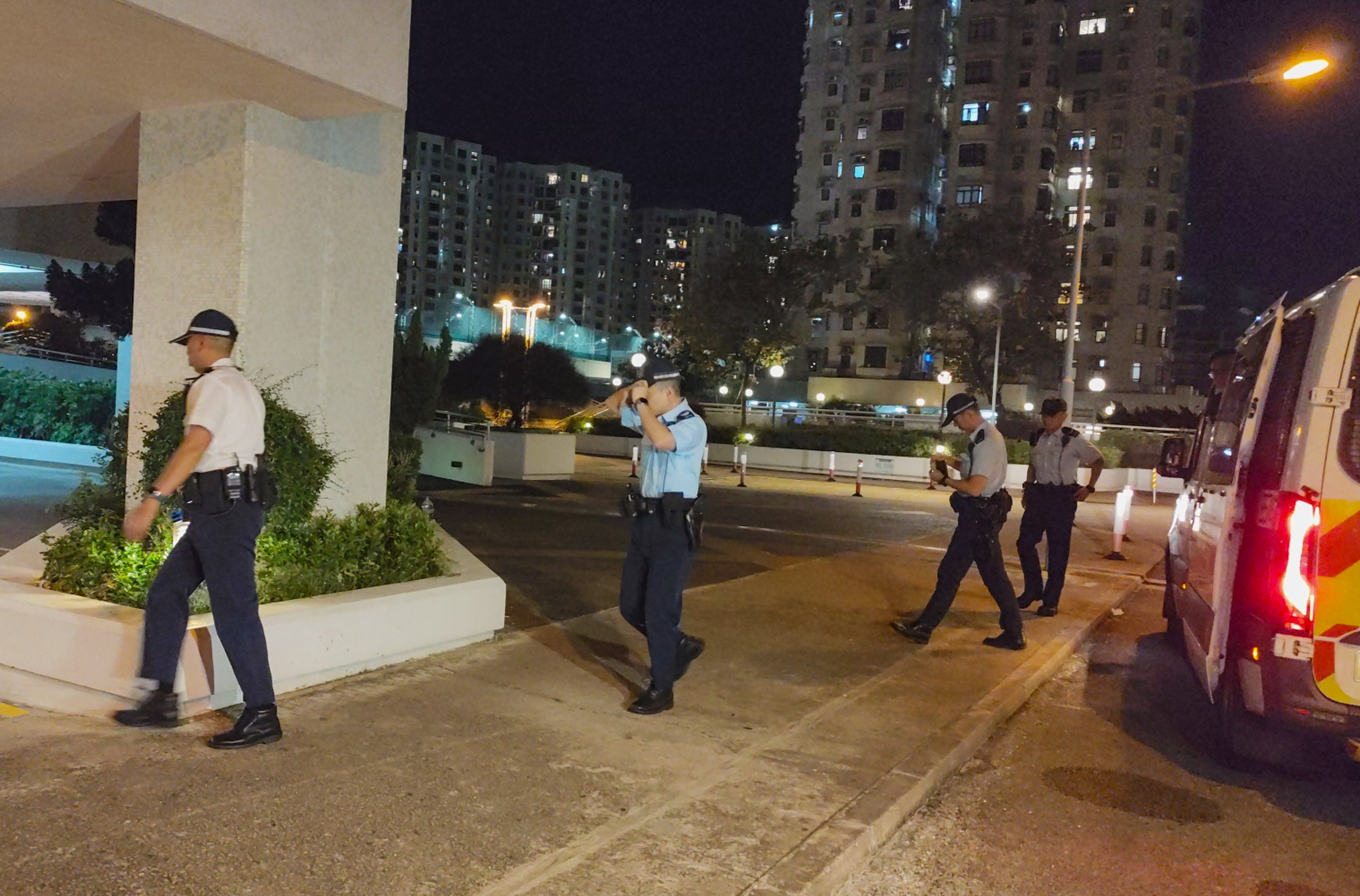 Police officers arrive at the Heng Fa Chuen private residential estate on Wednesday, where they found the 53-year-old woman dead. Photo: Handout