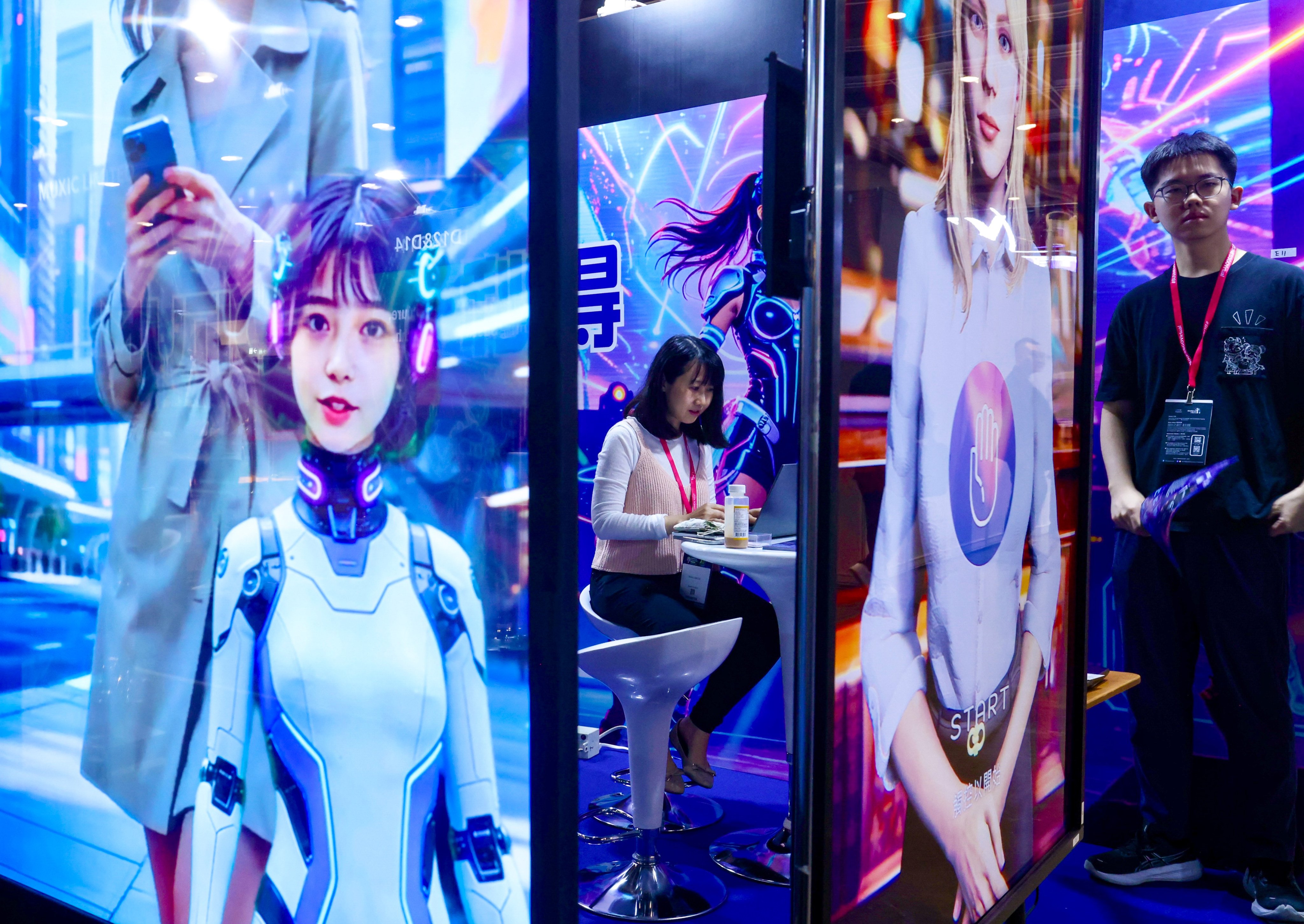 A woman works at a booth at AI+ Power 2026, Hong Kong’s largest artificial intelligence expo and conference, at the Hong Kong Convention and Exhibition Centre in Wan Chai on June 4. Photo: Jonathan Wong