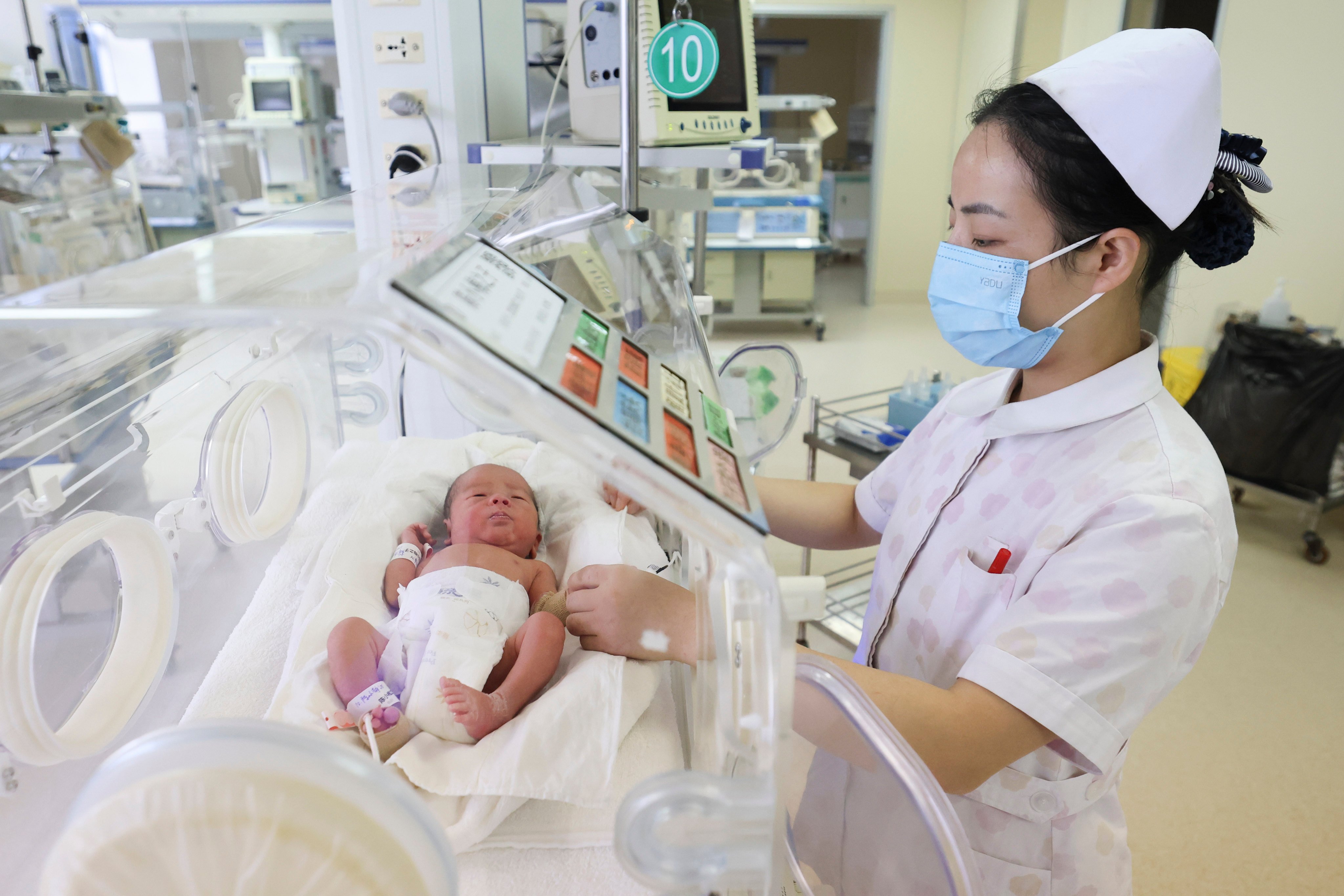 A medical staff member cares for a newborn at the neonatology department of Lianyungang People’s Hospital in East China’s Jiangsu province. Photo: CFOTO/Future Publishing via Getty Images