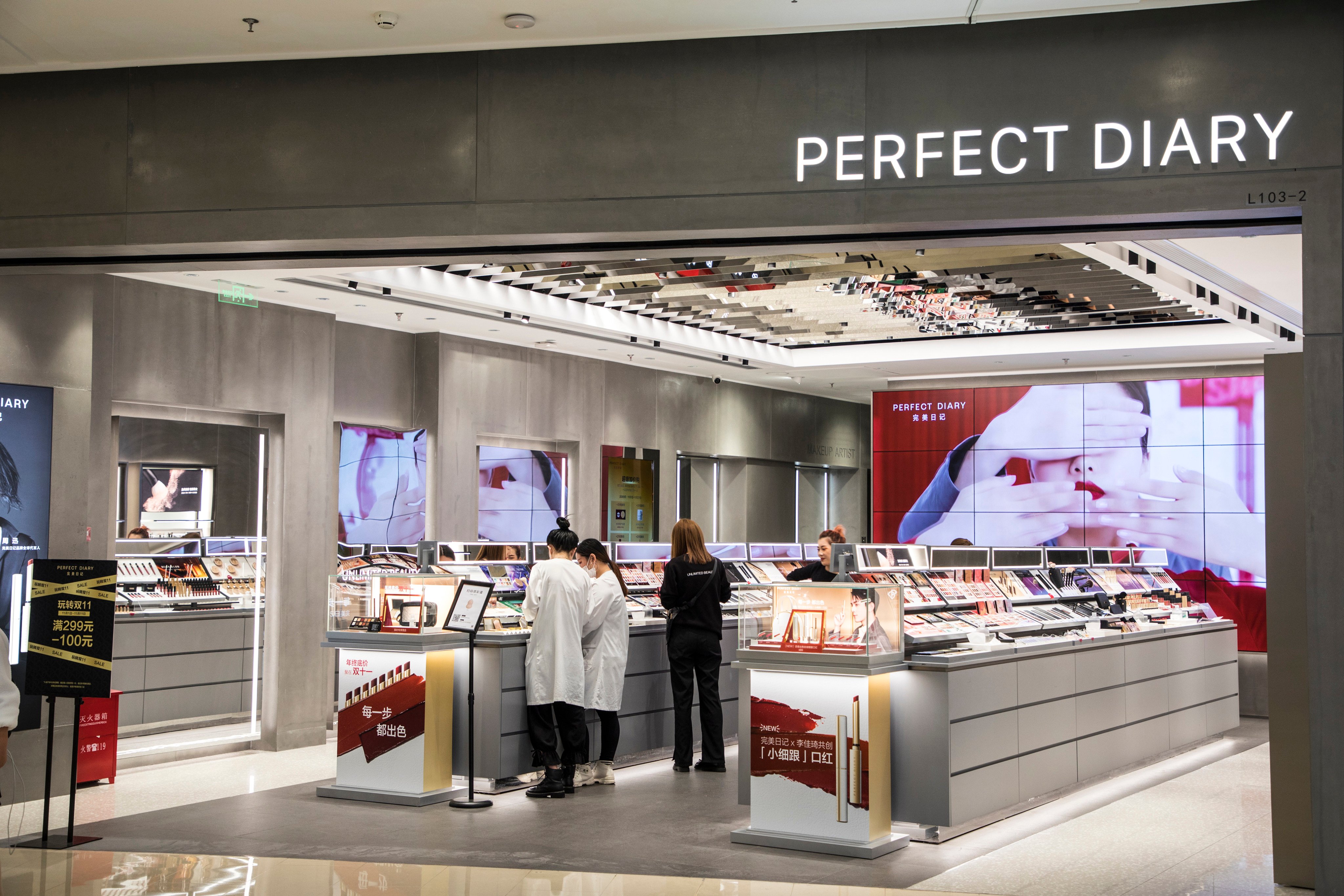 Customers browse cosmetics at a Perfect Diary store in Shanghai. Photo: Getty Images