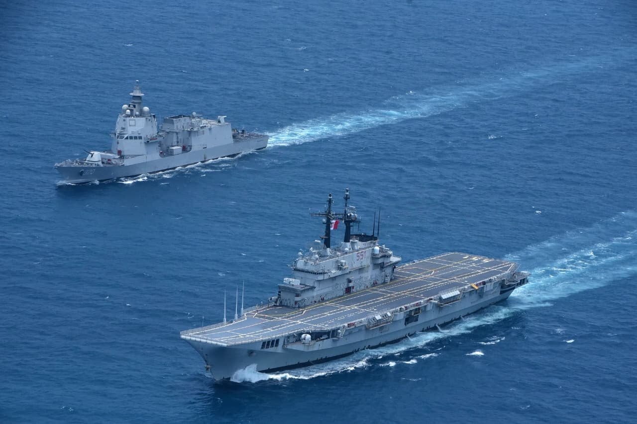 Former Italian Navy aircraft carrier ITS Giuseppe Garibaldi (right) sails in Indonesian waters on Thursday. Photo: EPA
