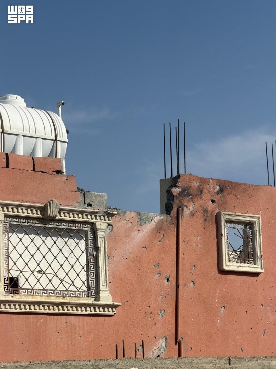 A building is damaged by shrapnel from a reported Houthi drone in  Taif on Thursday. Photo: Saudi Press Agency / AFP