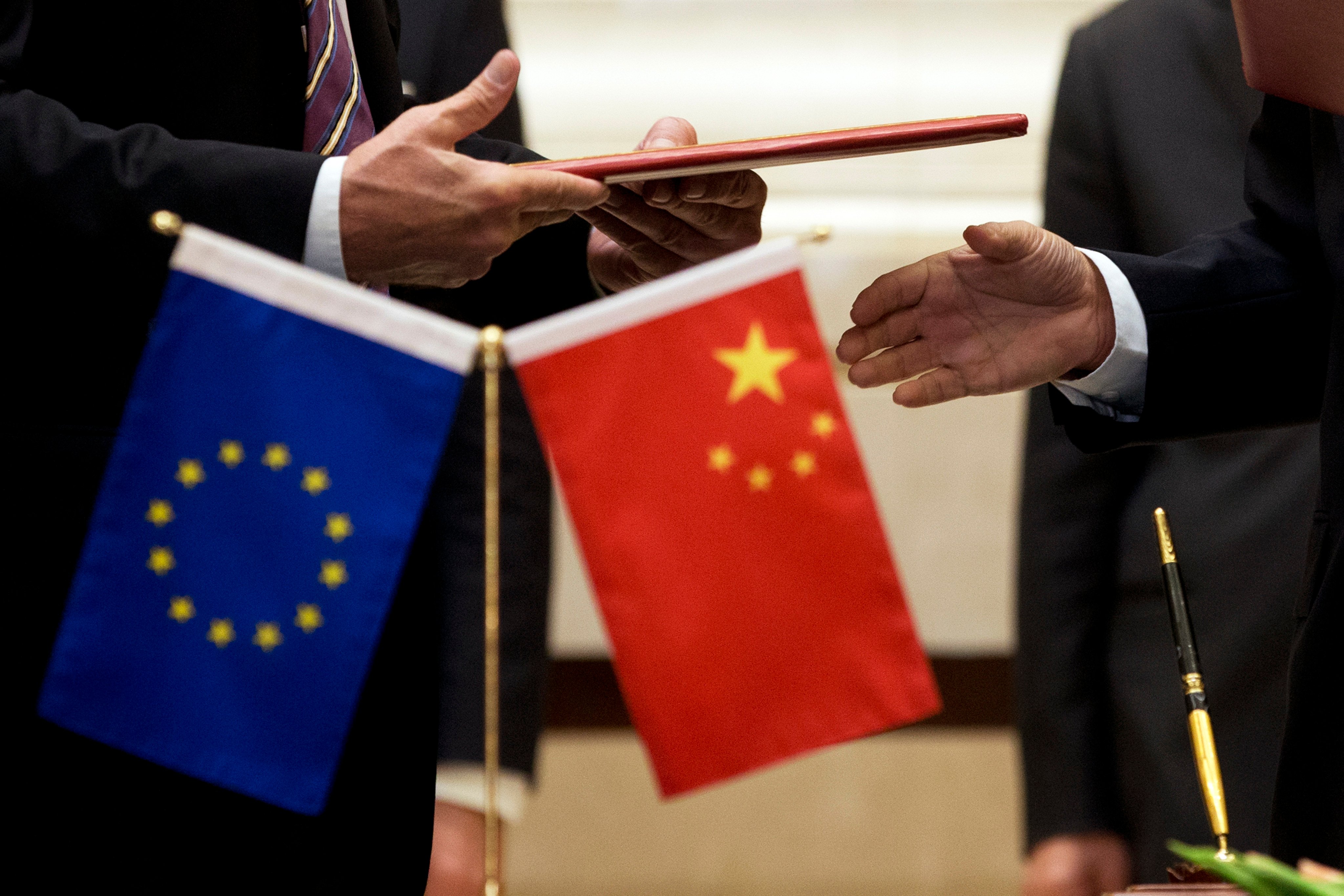 The EU and Chinese flags at trade talks in Beijing in 2015. Photo: AP