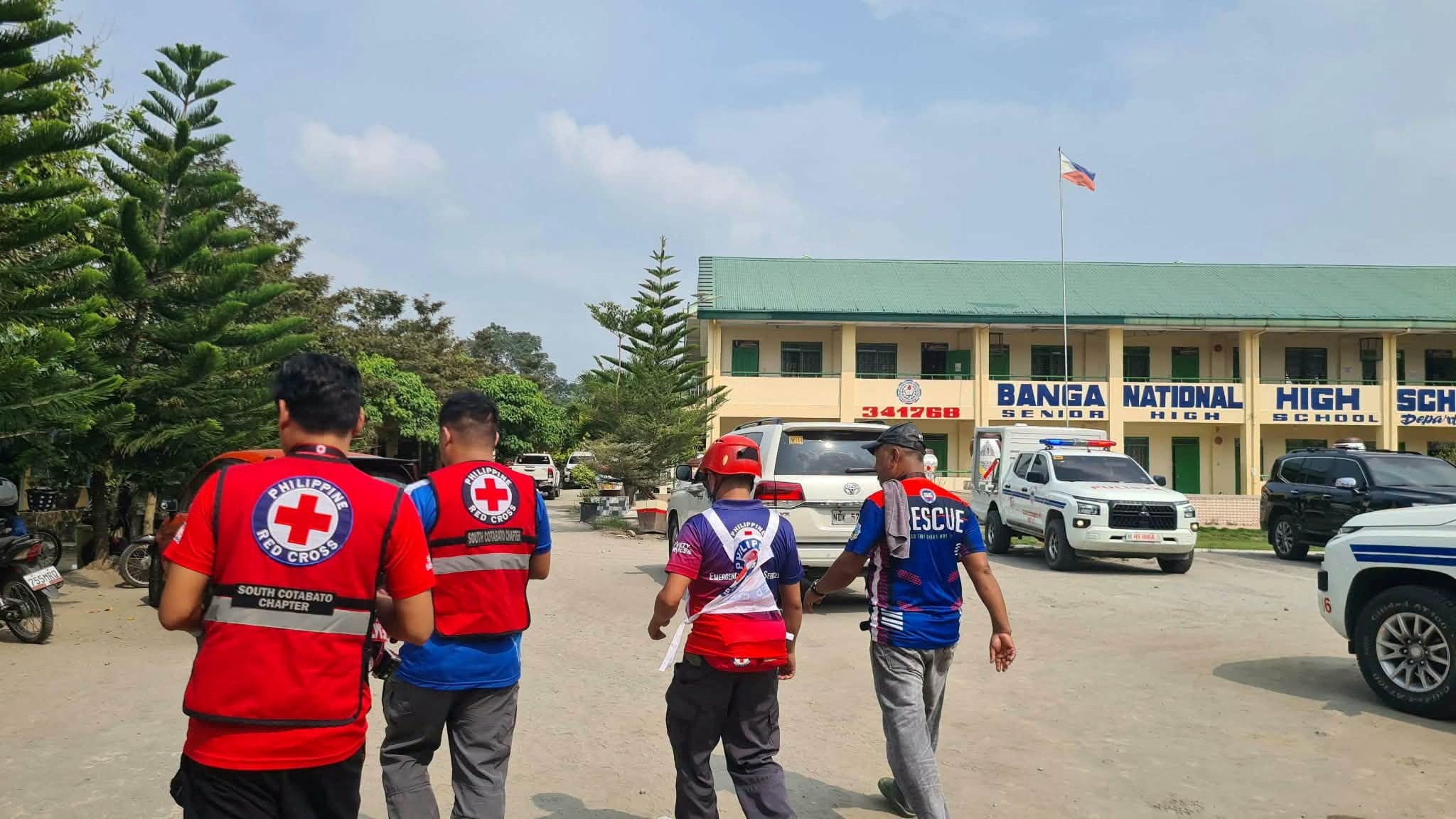 Emergency personnel walk at the site of a deadly shooting at a school in Banga, South Cotabato, Philippines, on Friday. Photo: Philippine Red Cross via Reuters