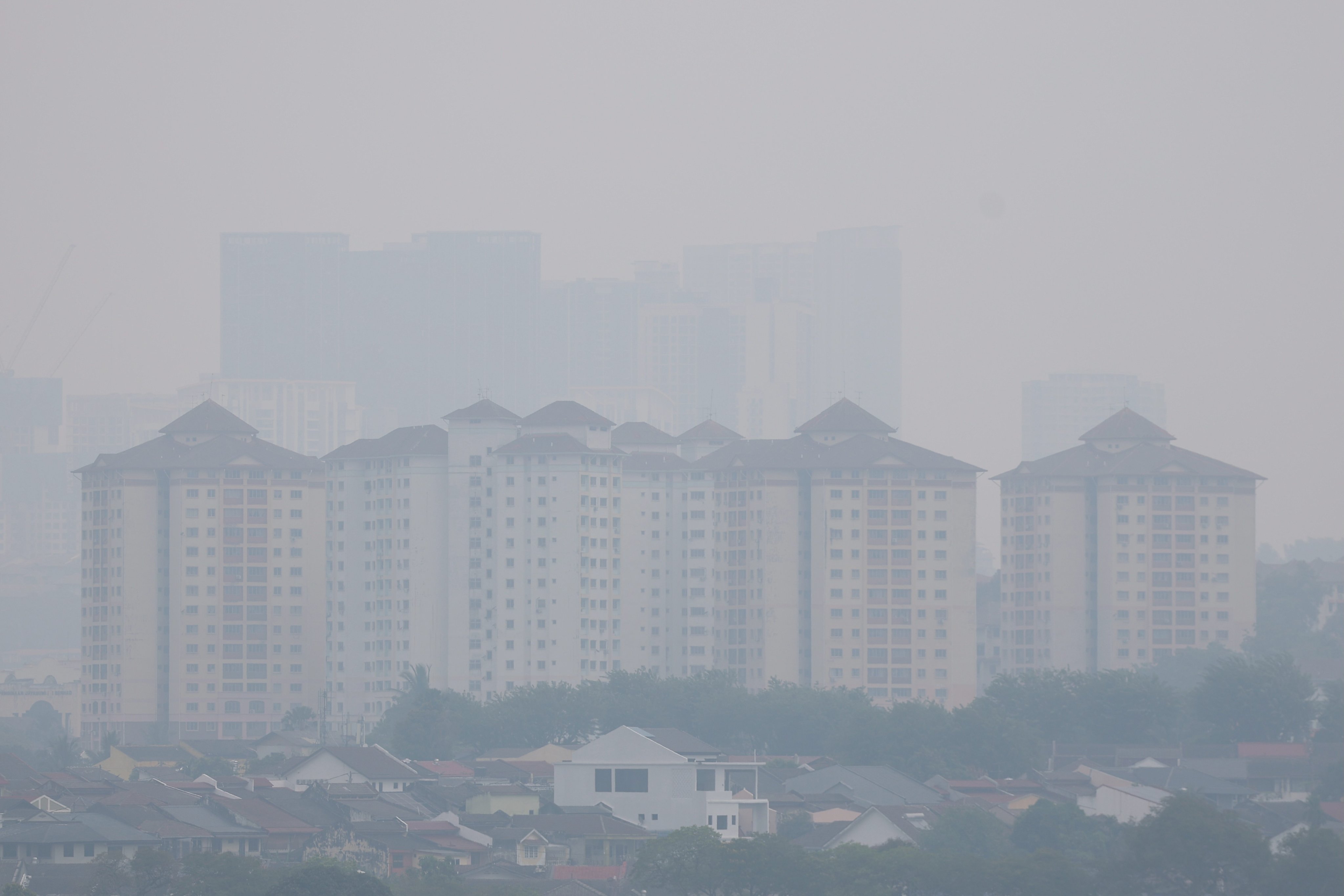 A residential area in Kuala Lumpur is blanketed in haze on Tuesday. Photo: EPA