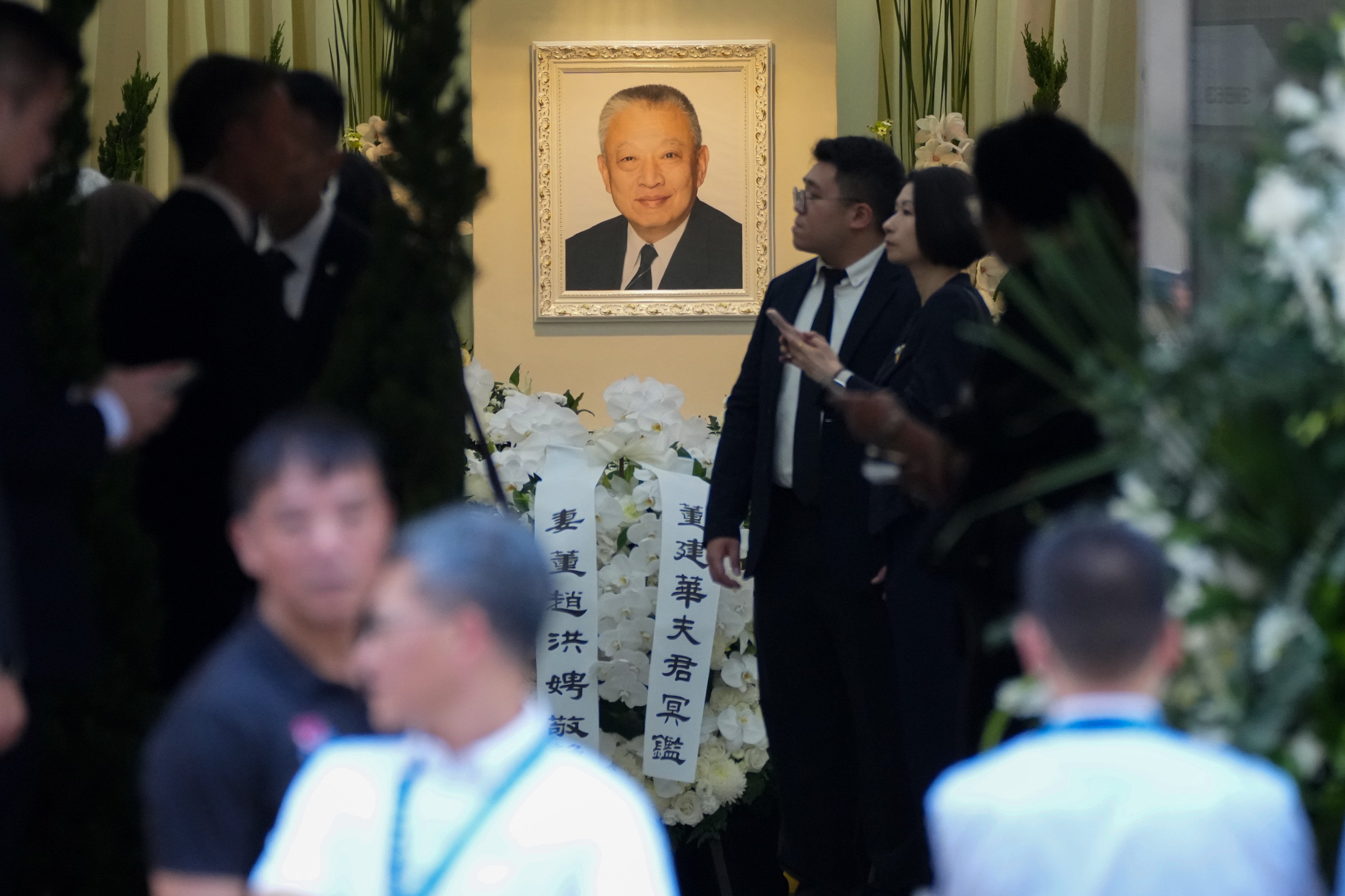A portrait of Tung Chee-hwa is displayed in the funeral hall. Photo: Kit Lai