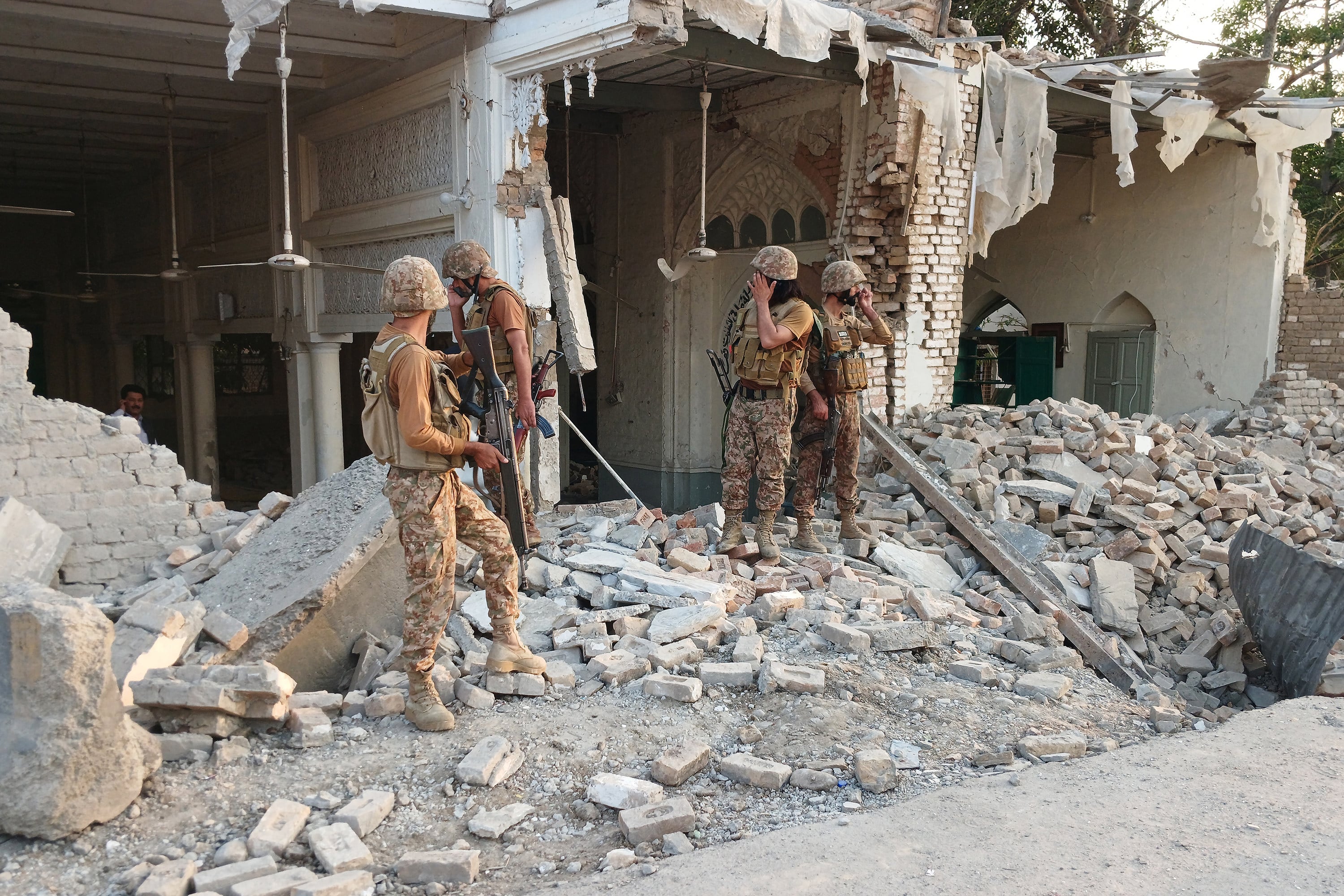 Army personnel stand amid the rubble following an explosion inside the Kohat police headquarters in Pakistan’s Khyber Pakhtunkhwa province on Friday. Photo: AFP