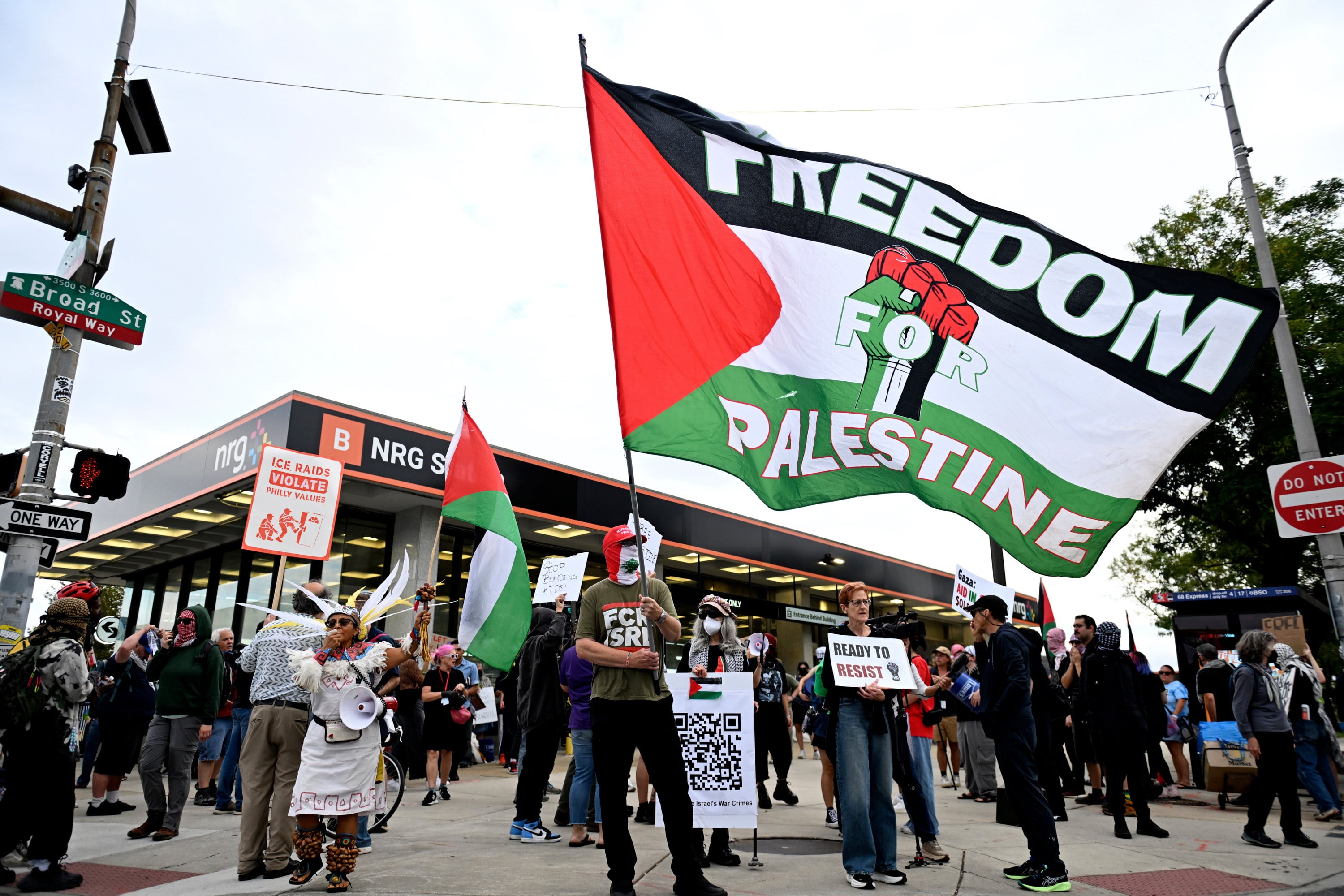 Pro-Palestinian demonstrators wave flags before an Ed Sheeran concert in Philadelphia on Saturday. Photo: AP