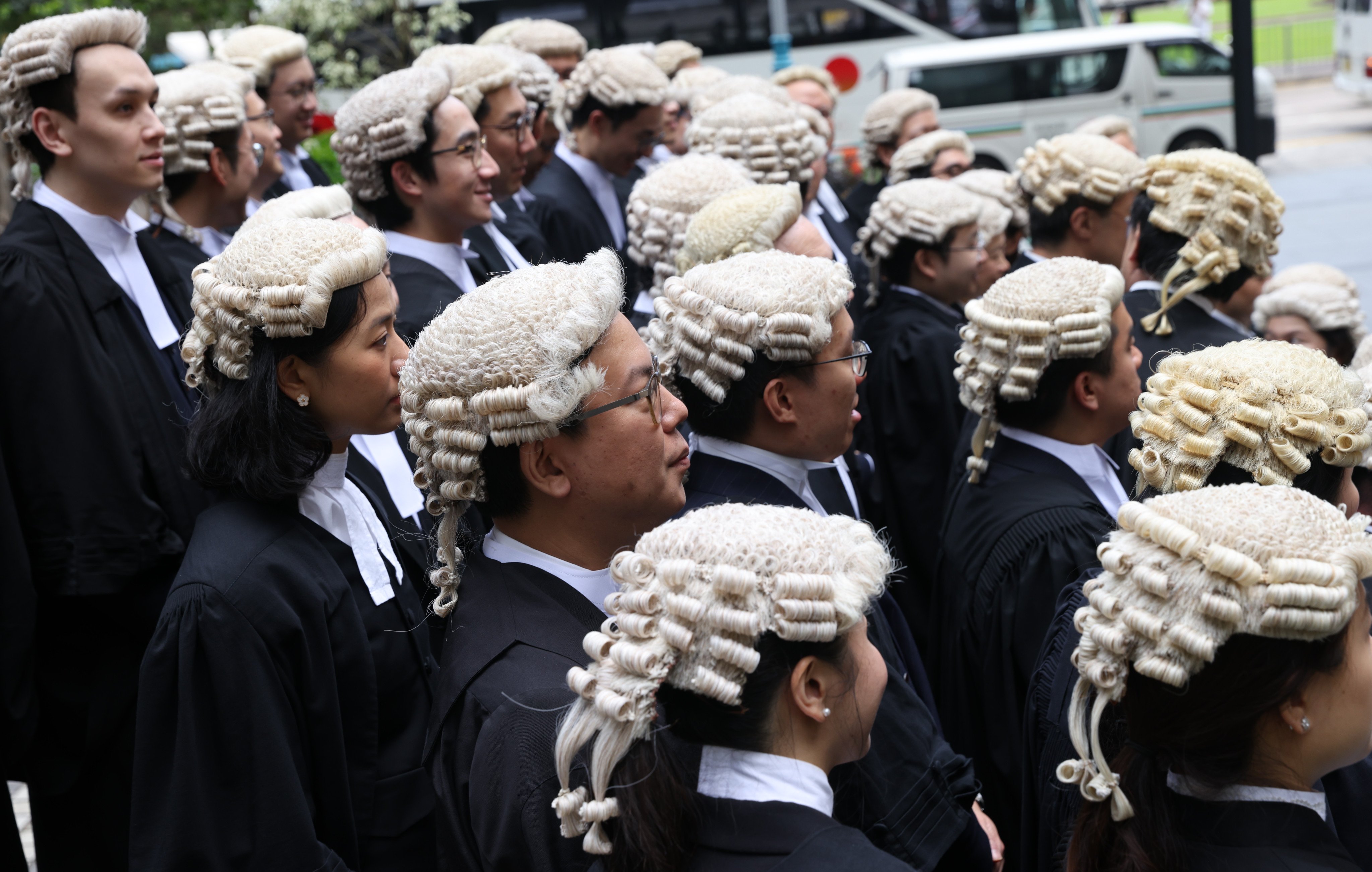 Barristers pose for a photo after their appointment as senior counsel at the Court of Final Appeal in Central. The Law Society is calling for the higher status for its solicitors as lawmakers scrutinise the latest round of omnibus legislative updates in Hong Kong. Photo: Yik Yeung-man.