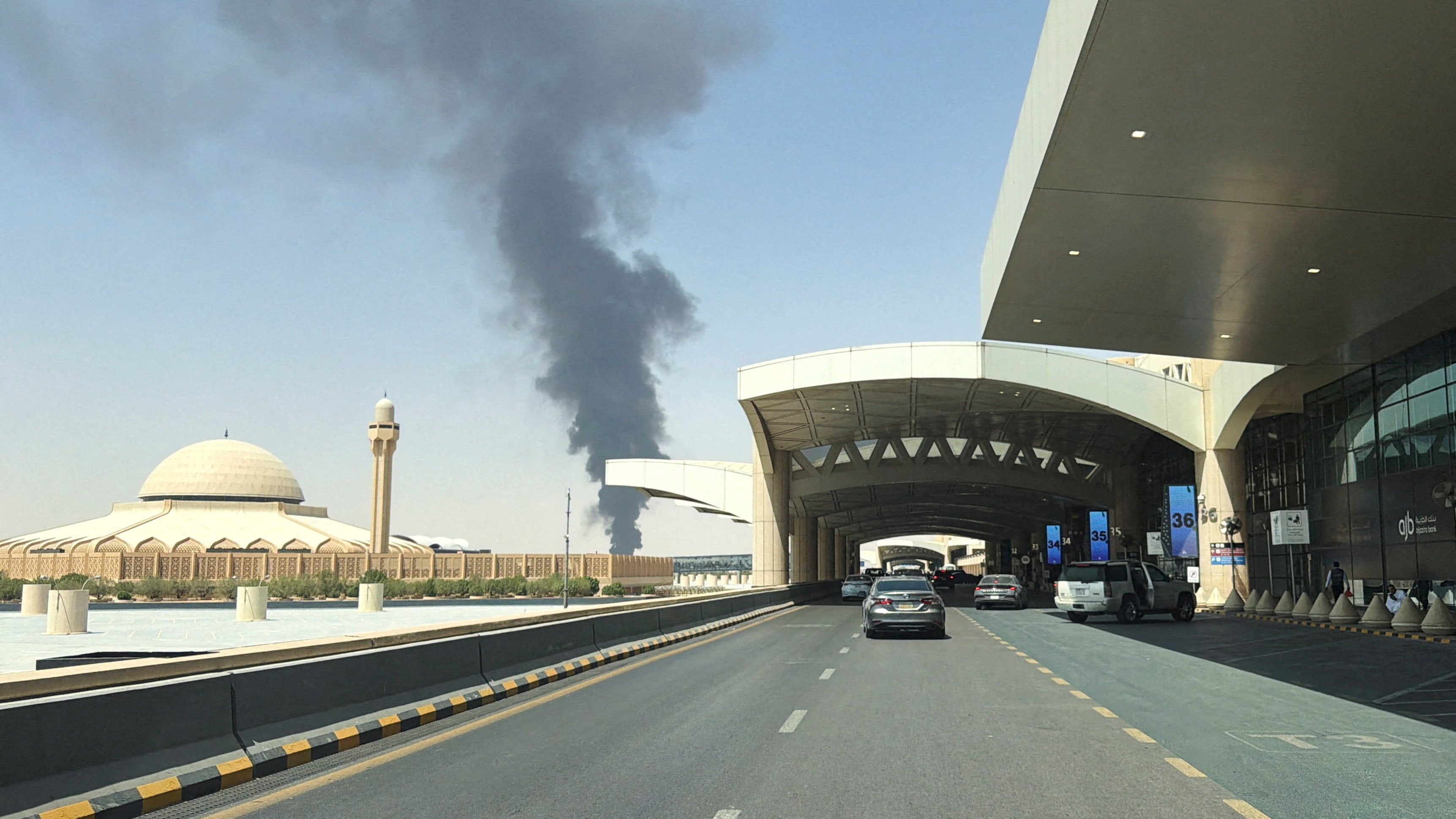 Large plume of black smoke rises from the fuel storage area at King Khalid International Airport in Riyadh, Saudi Arabia, on Saturday. Photo: Reuters